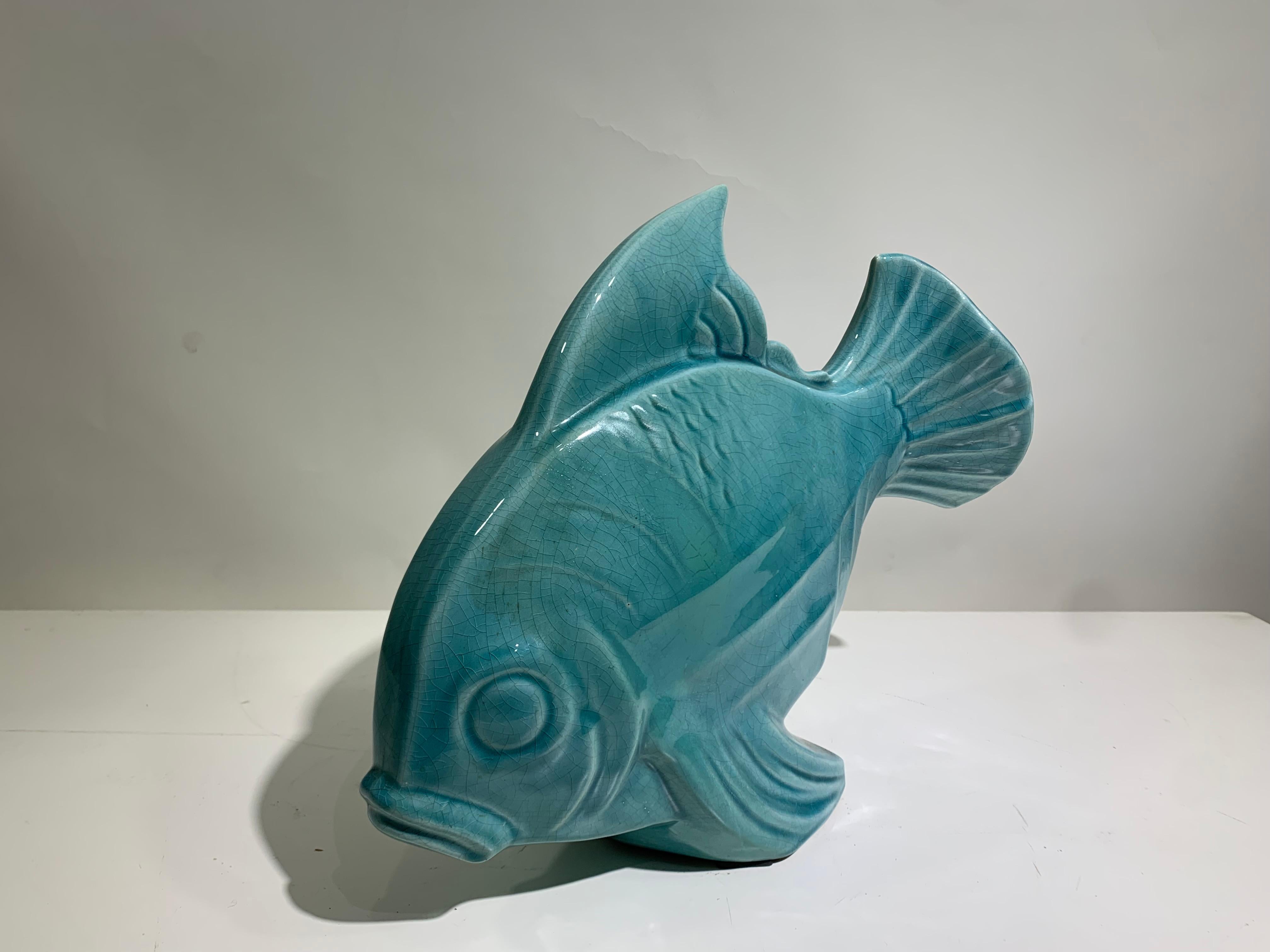 Art Deco ceramic fish with a crackle glaze finish originating from France and Art signed LEJAN to bottom fin and dating to the 1930''s. This really is a monster size ( see dimensions below) and looks superb in situ, perfect statement piece. 
Free