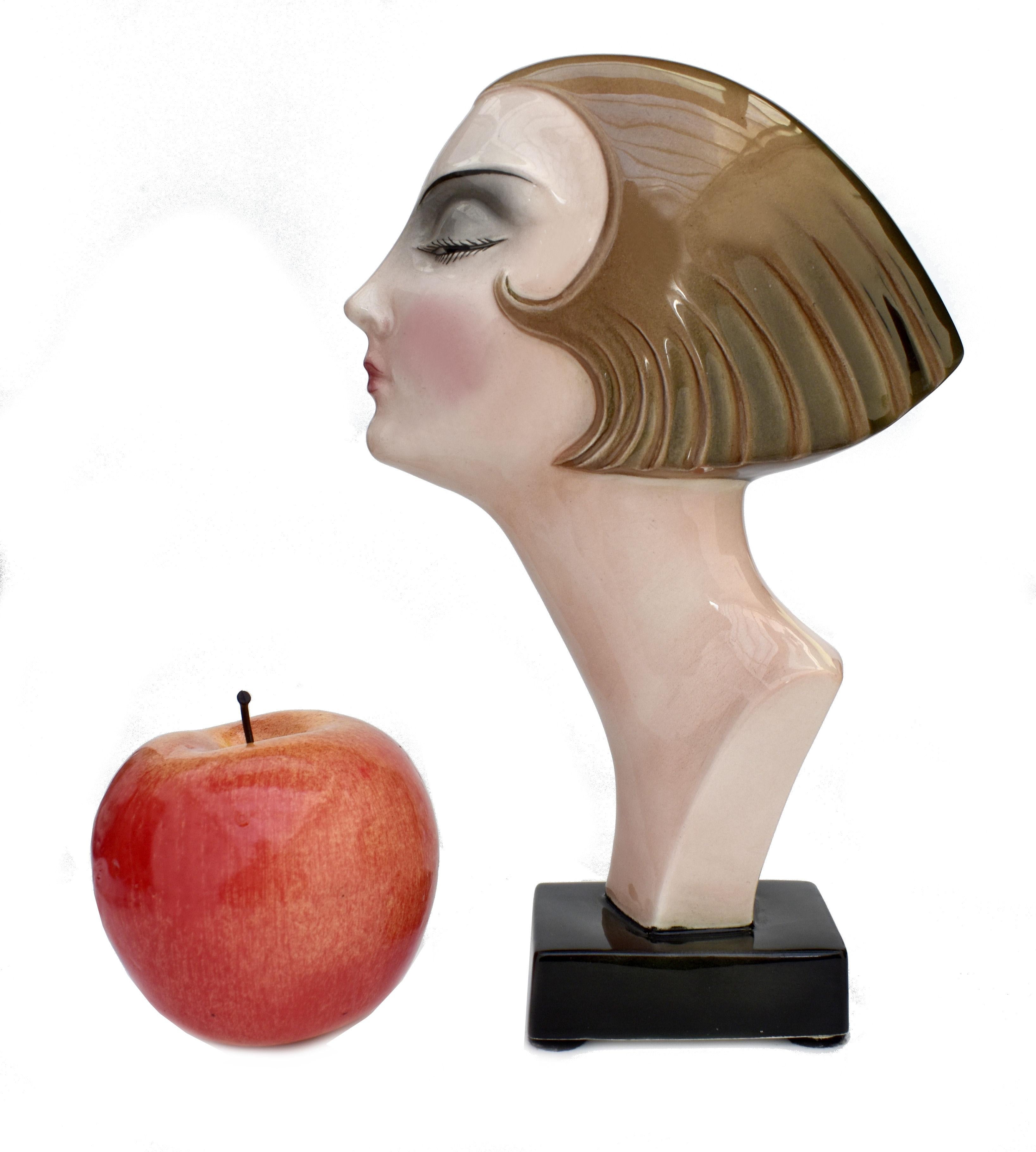 This rare and extremely stylish Art Deco ceramic bust is by the German maker Katzhutte Hertwig & Co and is modelled as a lady's profile with with bobbed hair. The reverse of the mask has the stamped registration numbers '1702'. Great condition.