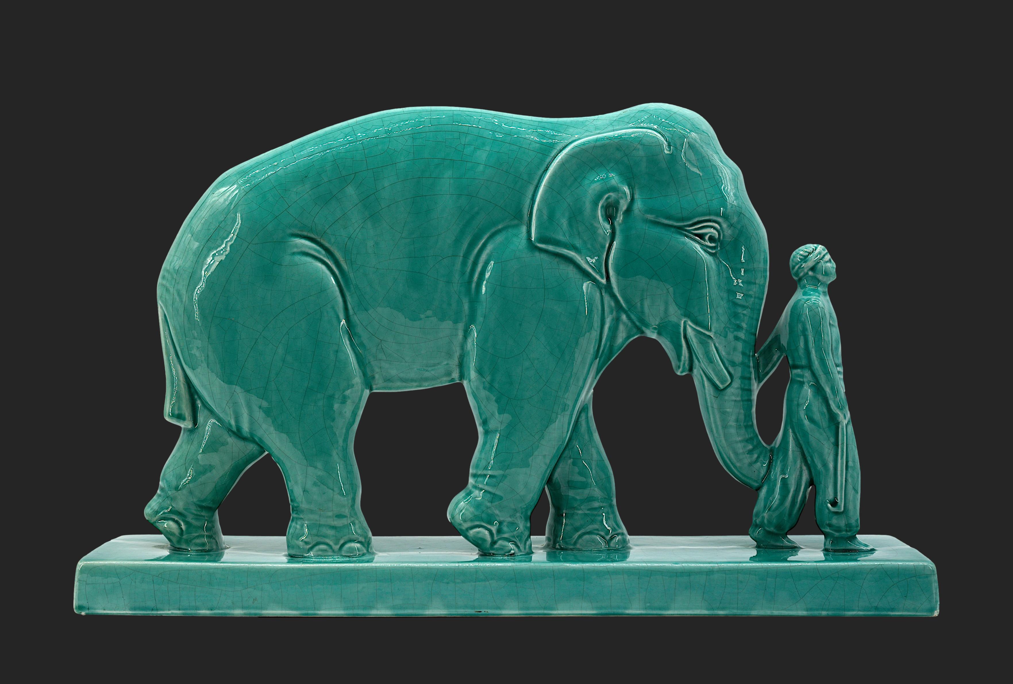 French Art Deco Elephant and Mahout Sculpture by Stef, Saint-Clément, France, 1920s. This striking French Art Deco sculpture, created by Stef in Saint-Clément in the 1930s, features an elephant and its mahout, beautifully crafted in crackle glaze