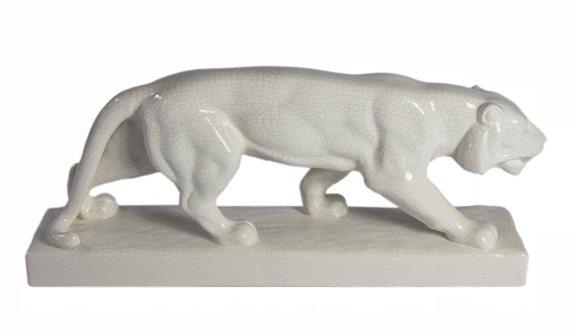 Emaux de Louviere ceramic panther sculpture from Art Deco period circa 1930's.
Hand crafted sneaking panther with crackle glazed surface in ivory colour.
Marked on the bottom.