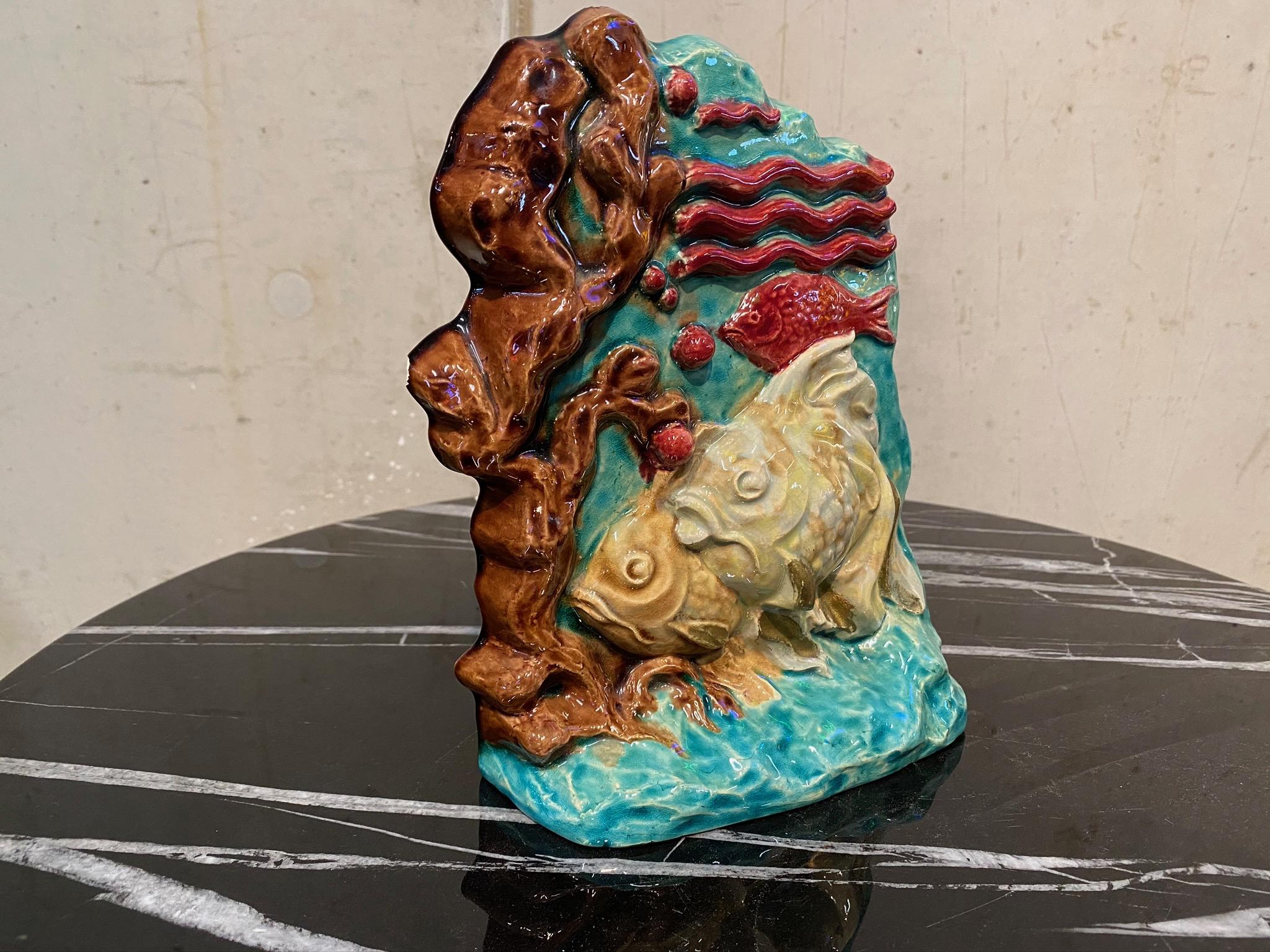Unique handmade ceramic sculpture from Paris, France. The pictured fish and underwater landscape is elaborated in great detail. On the right edge a small piece of the edge is slightly off-centered.