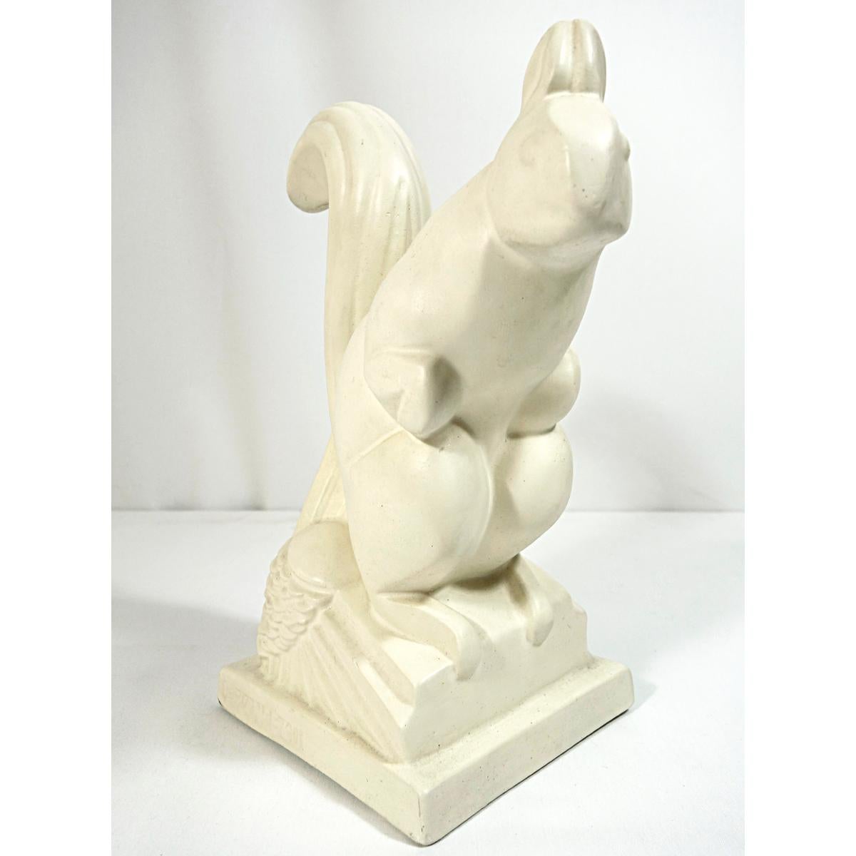 Charming Art Deco ceramic squirrel in cream by French artist Charles Lemanceau (1905-1980). A stylized depiction set on an integral architectural plinth with stylized pine cones.
Signed Lemanceau on plinth.
French, 1930s.