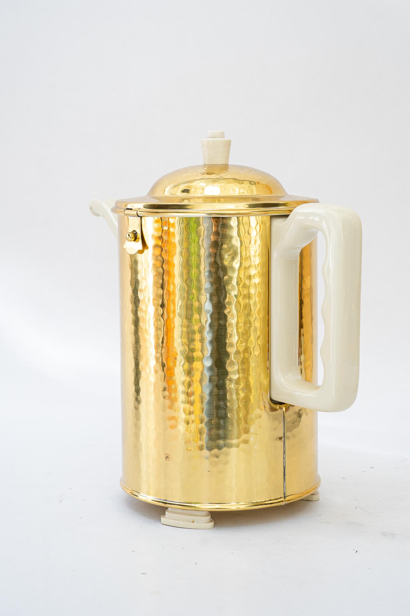 Art Deco ceramic thermos with brass cover coffee can germany around 1920s
The cover is polished and stove enameled
The cermaic is original condition