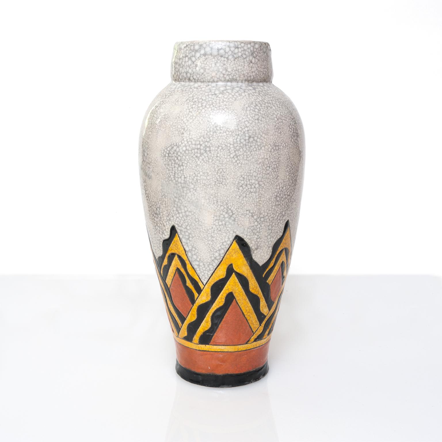 A tall beautifully glazed and decorated Art Deco ceramic vase by Charles Catteau for the Belgium company Boch Freres. 
Height: 18