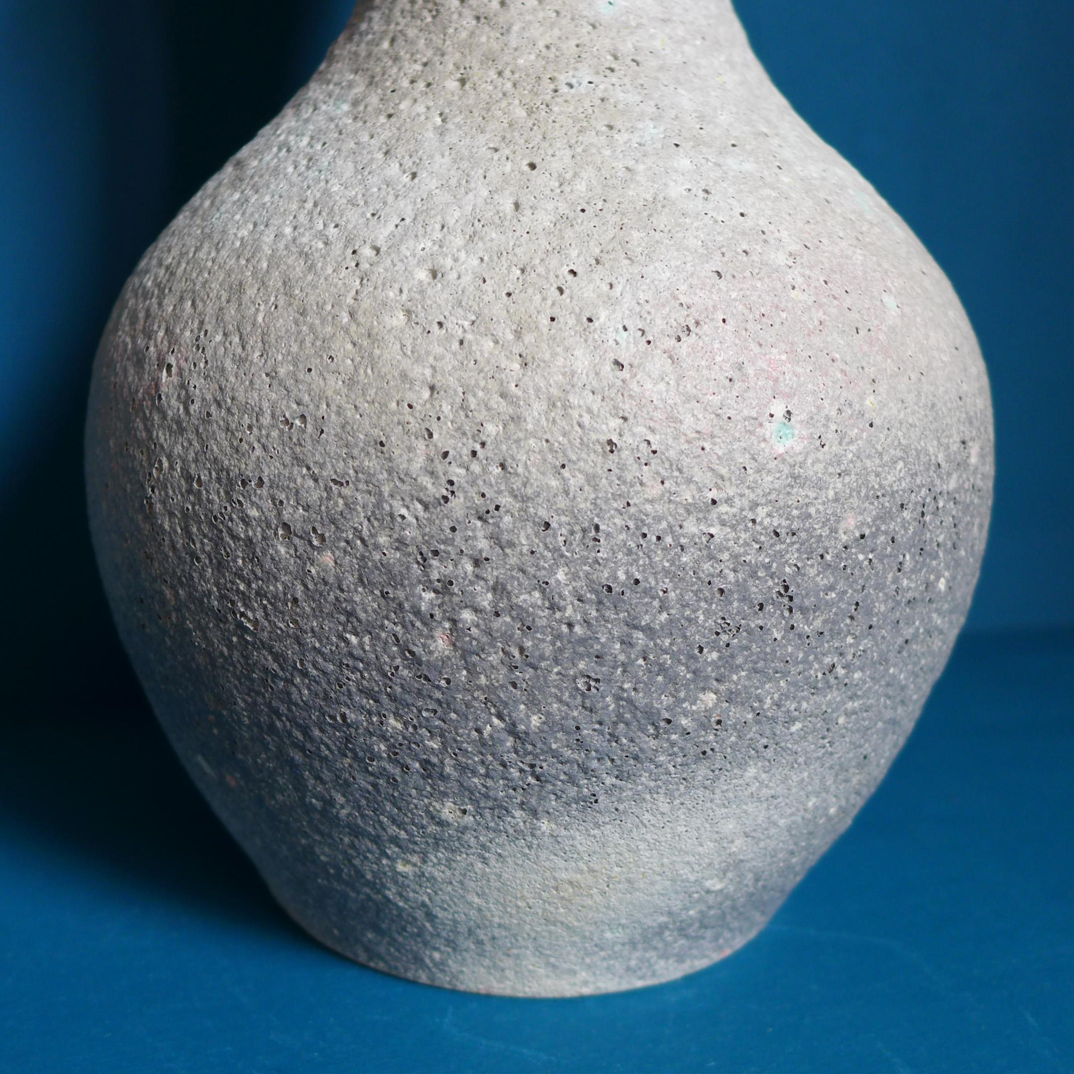 A piece of Dutch pottery history in the form of this beautifully glazed vase by Chris Lanooy, (1881-1948). Dry stone gray and blue glaze with a pitted texture.
Signed: C J Lanooy.
