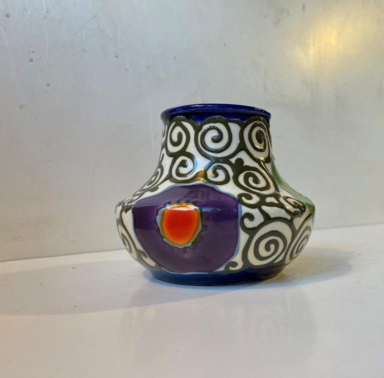 Colorfull hand painted ceramic vase from Czech Ditmar Urback. Made circa 1930-40 in the Czech Republic. Design/shape number 10215 I. Reminiscent in style to similar pieces by Herman August Kähler Denmark. Measurements: Height: 13 cm, Diameter: 15/9