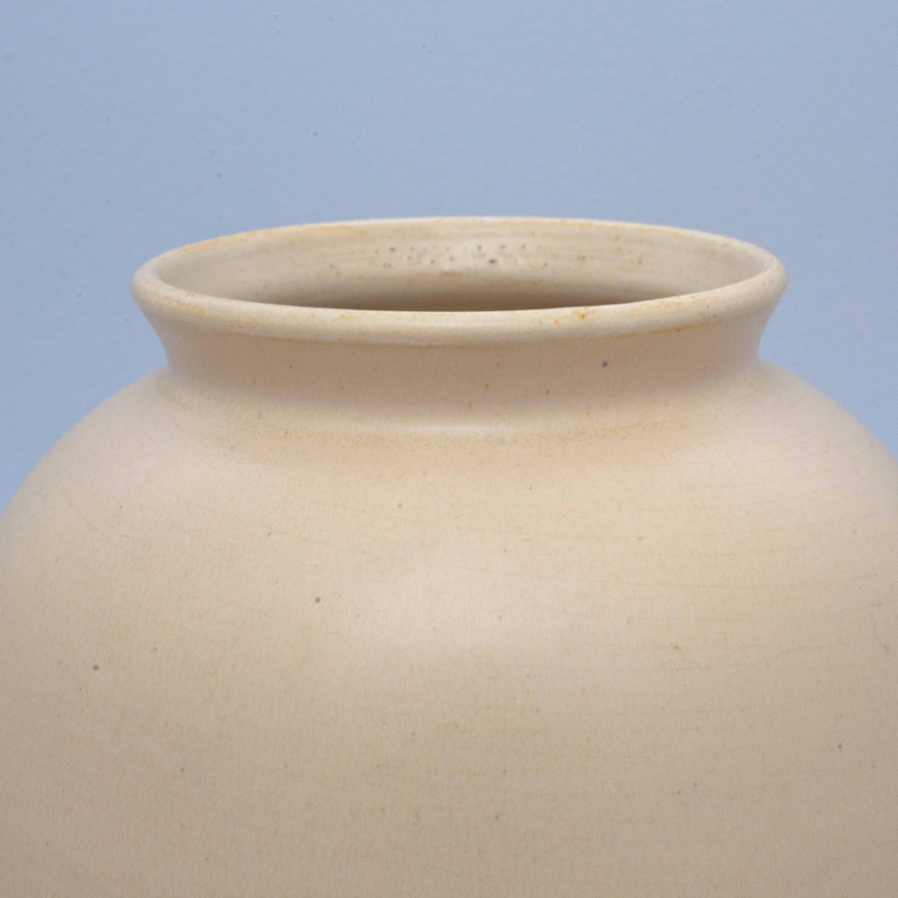 Cream colored ceramic vase produced by Dutch manufacturer ADCO (N.V. Groninger Steenfabrieken).