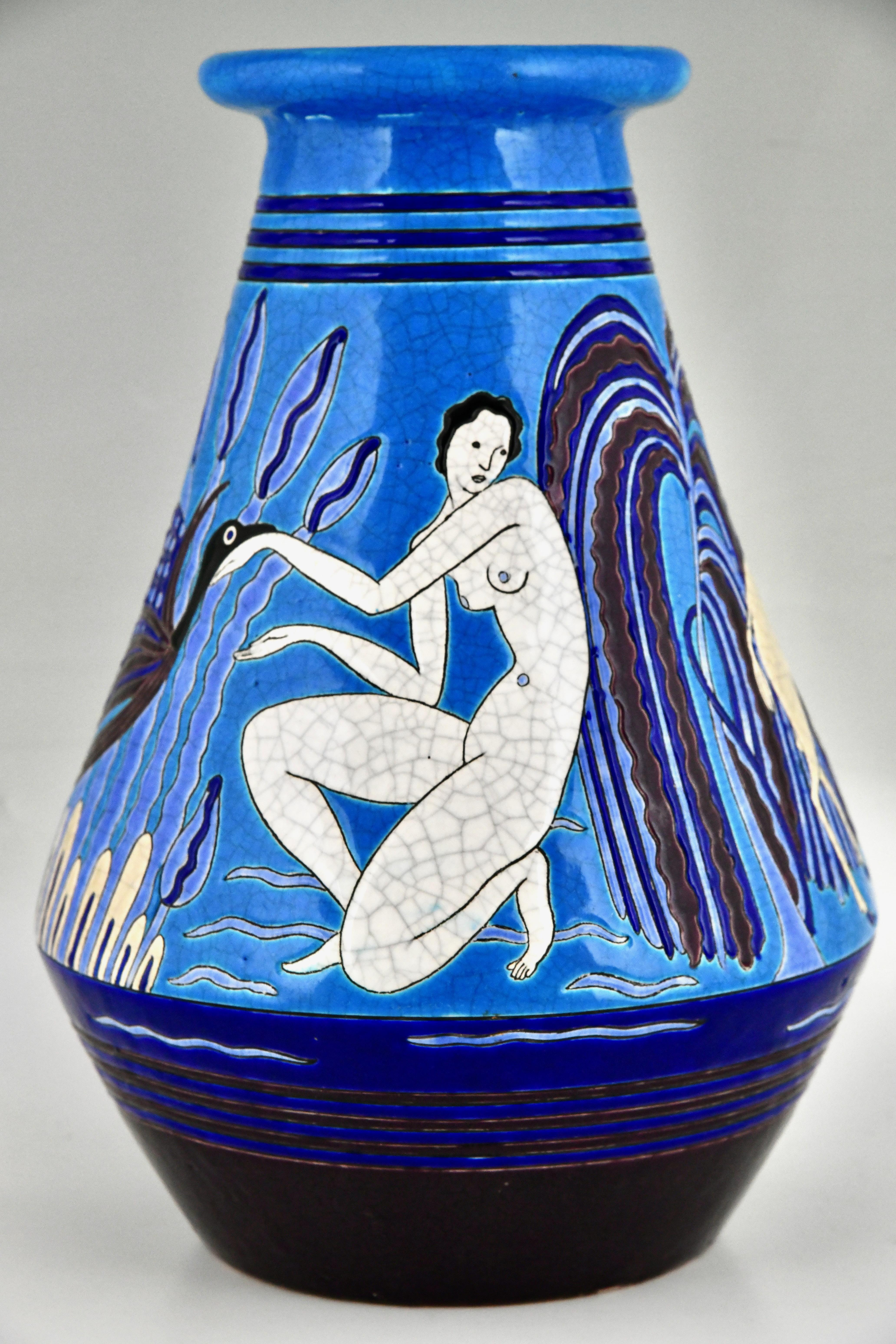 Art Deco vase with bathing nudes, peacock and ibex in shades of blue, purple, black and white. Aux Baigneuses. 
Marked Primavera, Longwy, France 1925. 
This French Art Deco vase was made by Longwy for Atelier Primavera, the design studio of the
