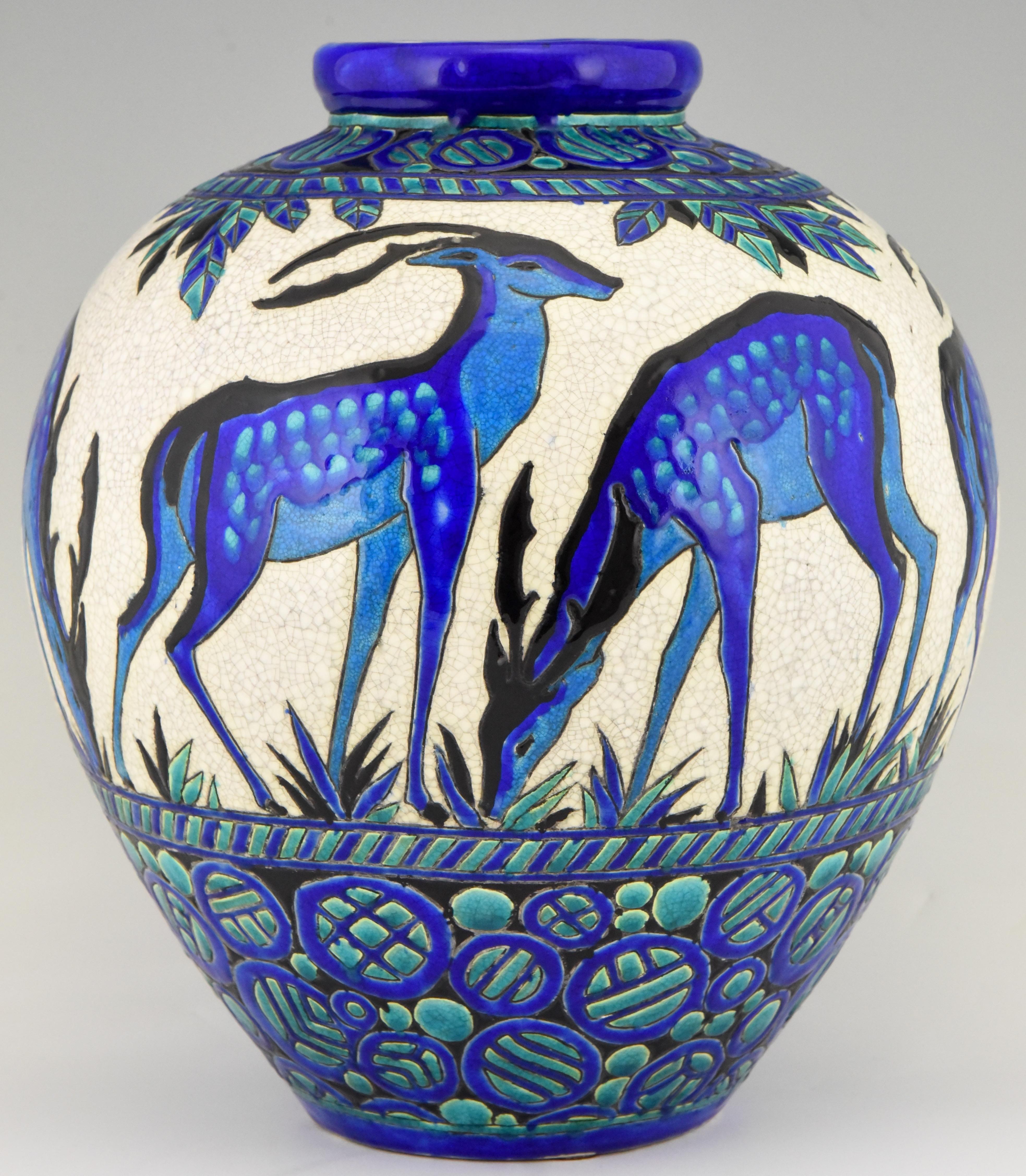 Charles Catteau Art Deco exceptional large deer vase, from the line Biches Bleues for Boch freres, La Louviere, Belgium.
Signed and numbered D 943 for the decor created between 1924-1925
The line was exhibited at the 1925 Exposition Internationale