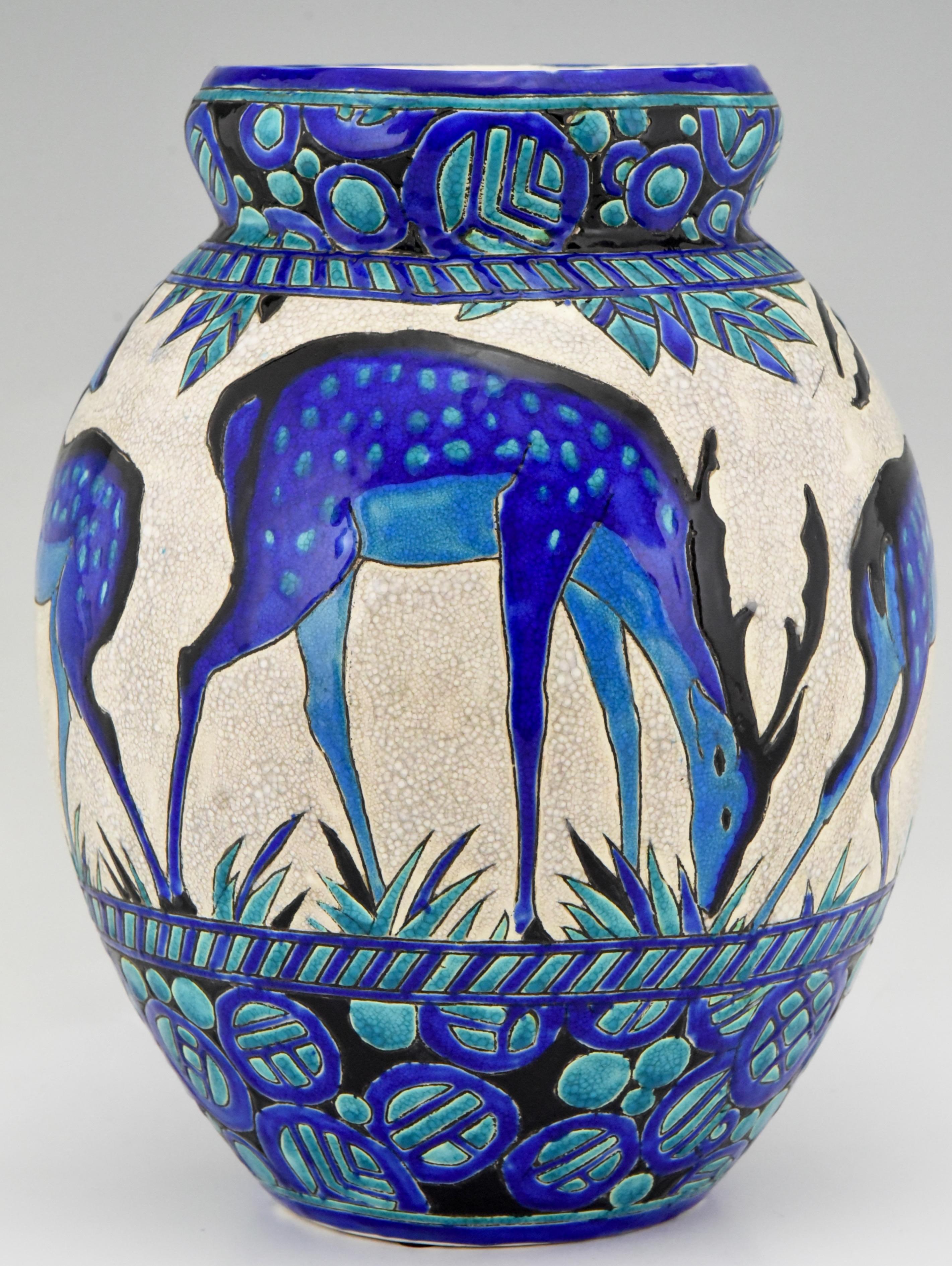 Charles Catteau Art Deco tall deer vase, from the line Biches Bleues for Boch frères, La Louviere, Belgium.
Signed and numbered D 943 for the decor created between 1924-1925
The line was exhibited at the 1925 Exposition Internationale des Arts