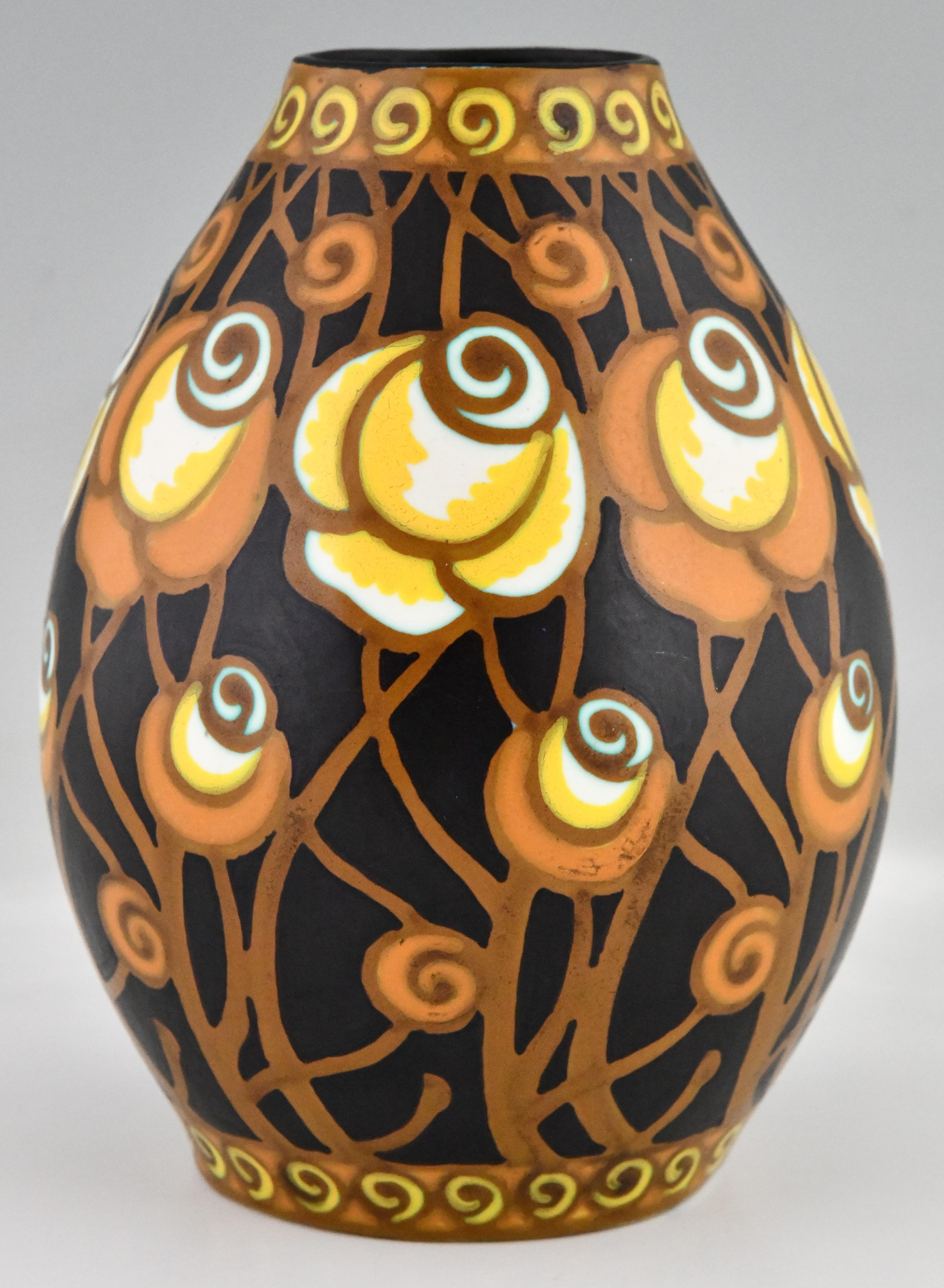 Art Deco ceramic vase with stylized flowers. Designed for the Atelier de Fantaisie by Charles Catteau. Boch Frères, Belgium 1925. Matt enamels on earthenware. Polychrome design with stylized floral motifs. Black, yellow, orange, brown, white. This