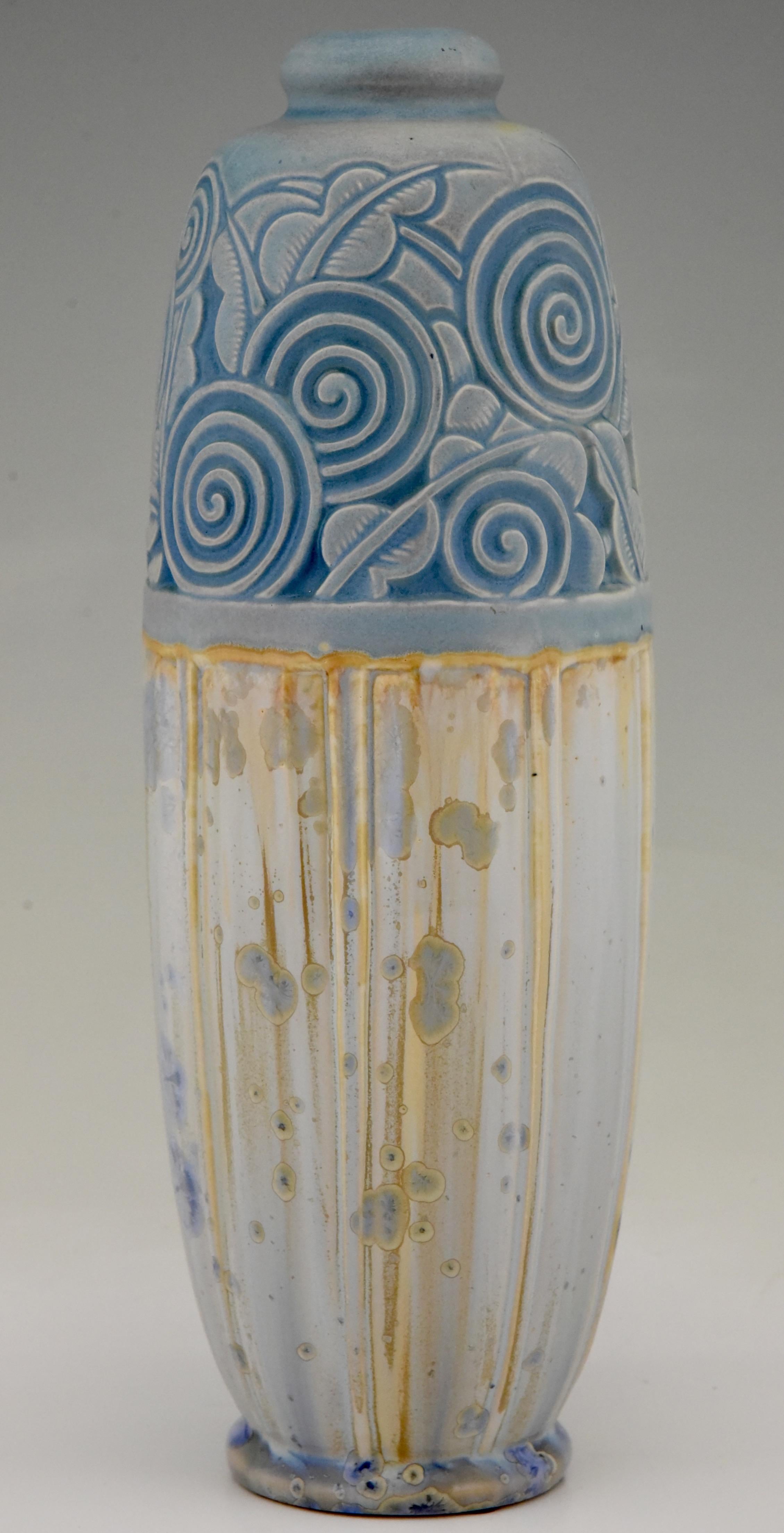 Art Deco ceramic vase with stylized flowers and leaves by Gaston Ventrillon (or Ventrillon le Jeune) for Mougin Nancy, France, 1925.
The grès ceramic vase has beautiful colors, an incised flower decor and a special glaze with crystallizations.