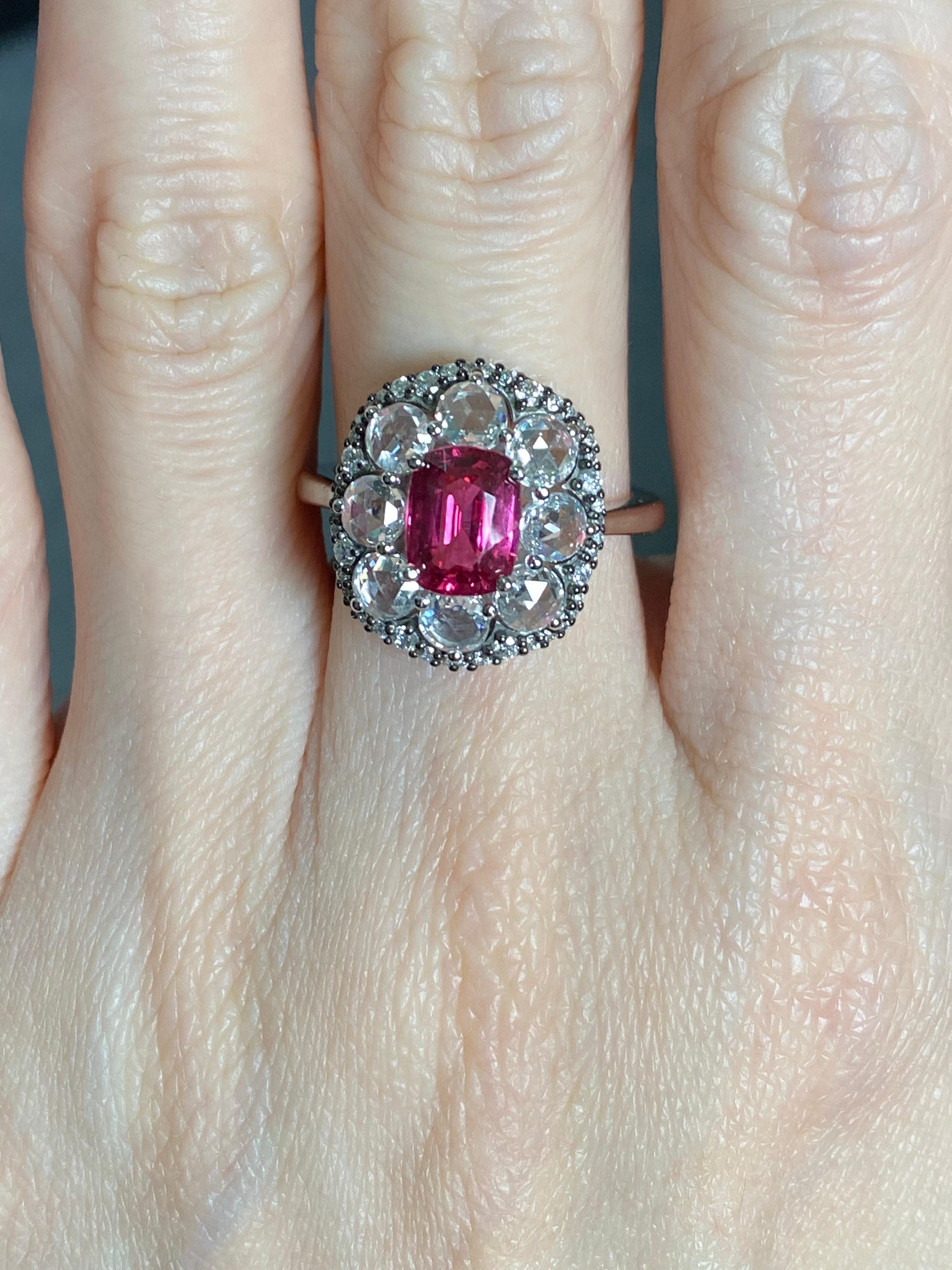 A stunning art-deco, vintage looking 1.53 carat natural Pink Spinel cushion shaped center stone, with 1.10 carat rose cut White Diamonds and 0.29 carat Diamonds set in solid 18K White Gold and black rhodium polish. Spinels has been frequently