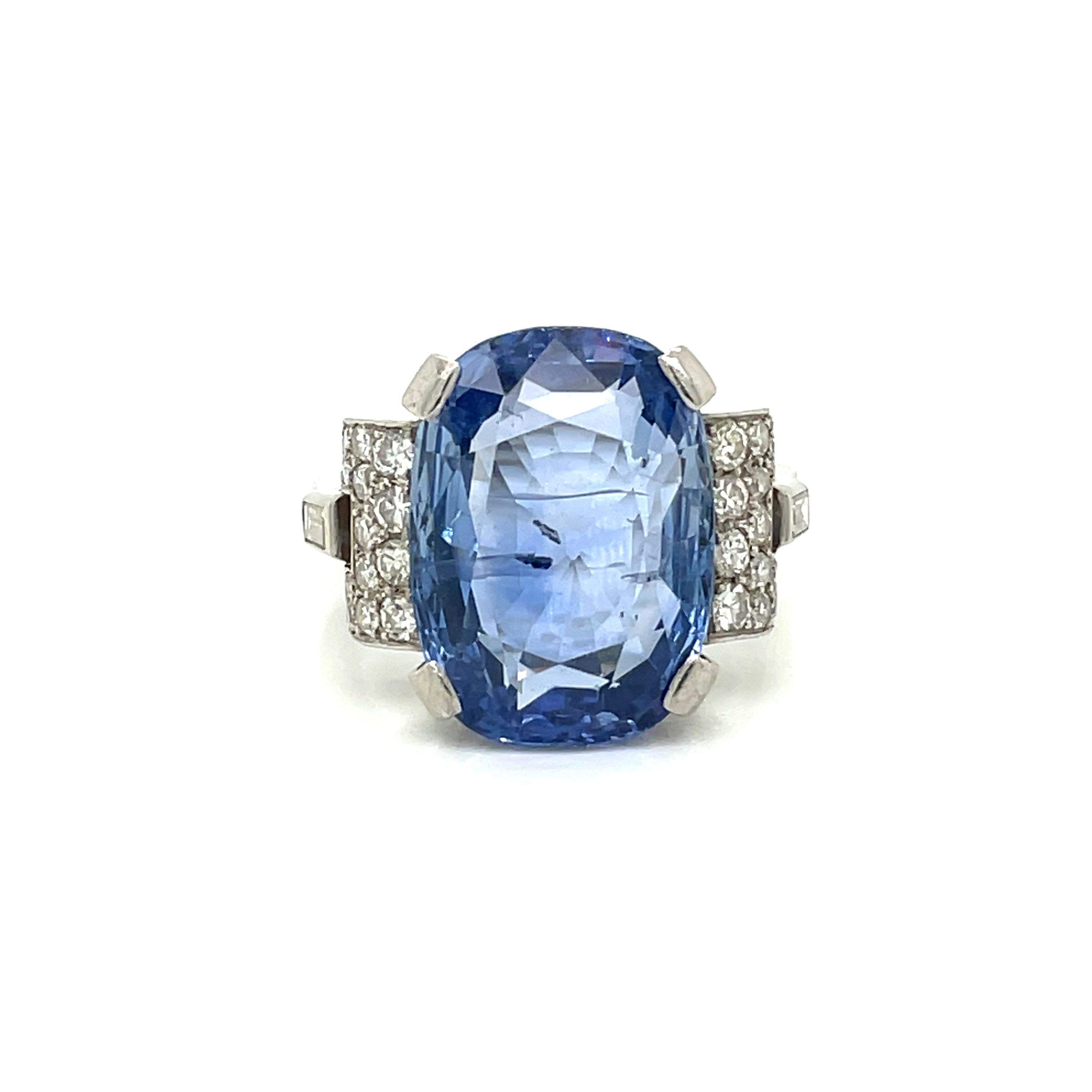 An exquisite genuine Art Deco ring handcrafted in Platinum by master jewelers, featuring an amazing rare vivid 15.50 carat Unheated untreated Natural Ceylon Sapphire cushion-shape, surrounded by 1.00 carats of old cut diamonds.

The Sapphire is