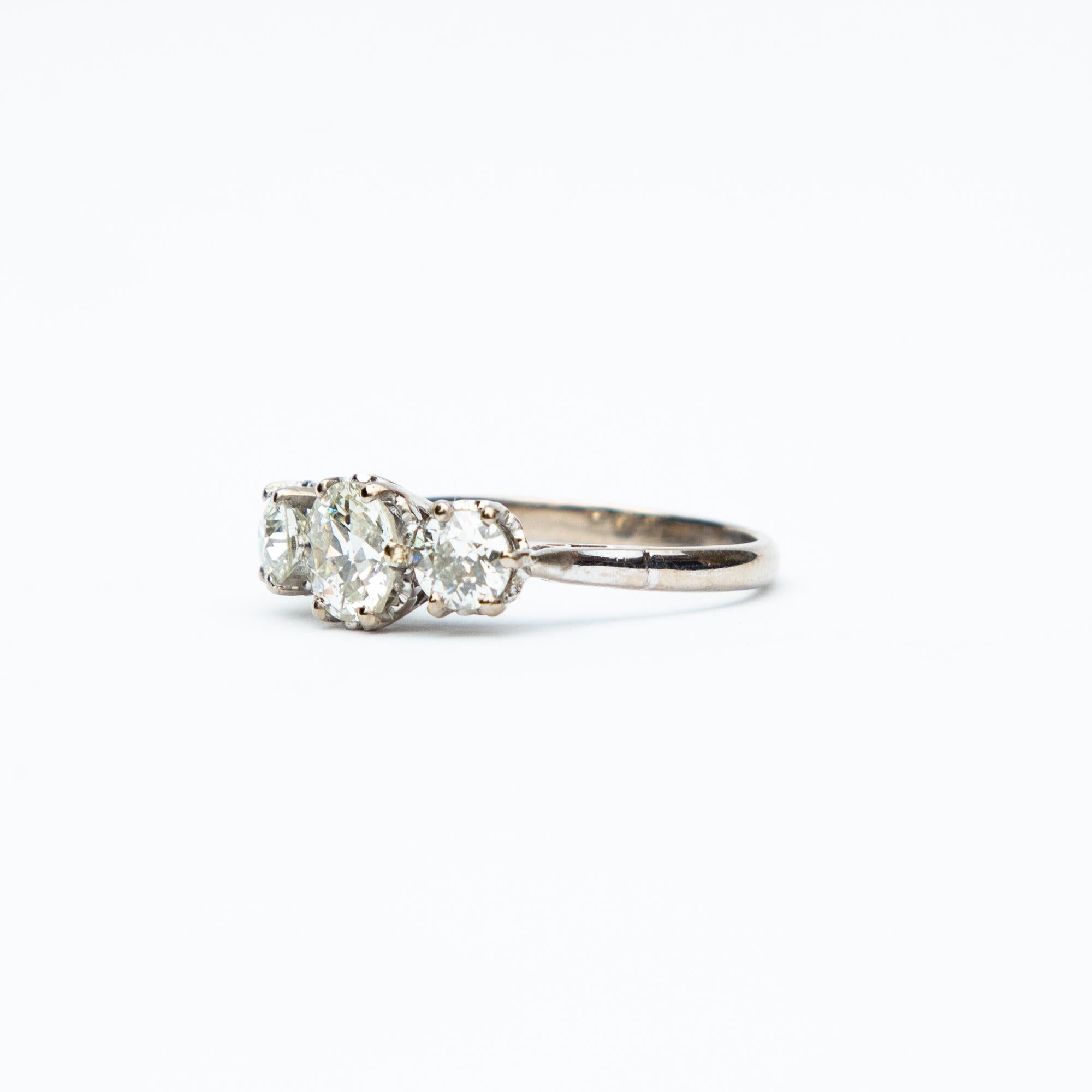 A simply stunning Art Deco Diamond three stone ring. Each a these beautiful diamonds is old European cut with the central stone being the largest. This lovely piece is eighteen carat white gold set, each diamond secured by six claws. Total diamond