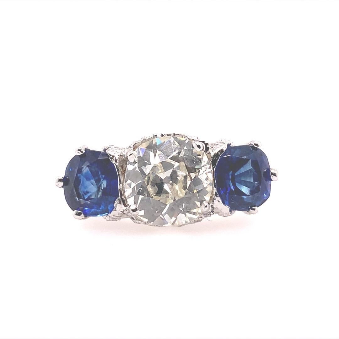 Authentic Platinum Art Deco 5.80 Carat Diamond and Sapphire Engagement Ring, Circa 1930.

The centerstone is UGS (EGL USA affiliate) certified as a 2.48 carat Natural Old European Diamond K-L in color and VS2 in Clarity. The ring is set with 101