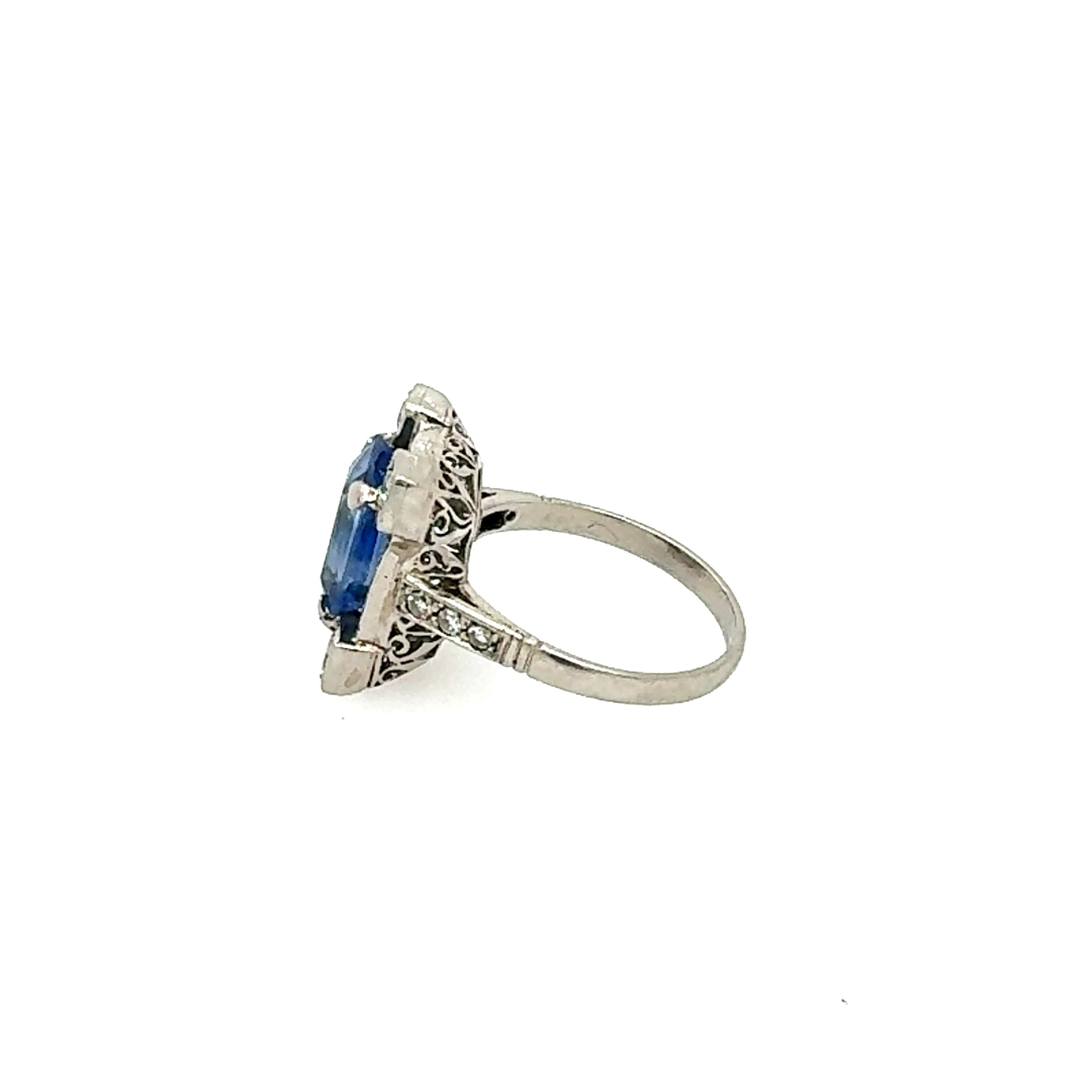Emerald Cut Art Deco Ceylon Blue Sapphire Ring with Baguette and Round Diamonds For Sale