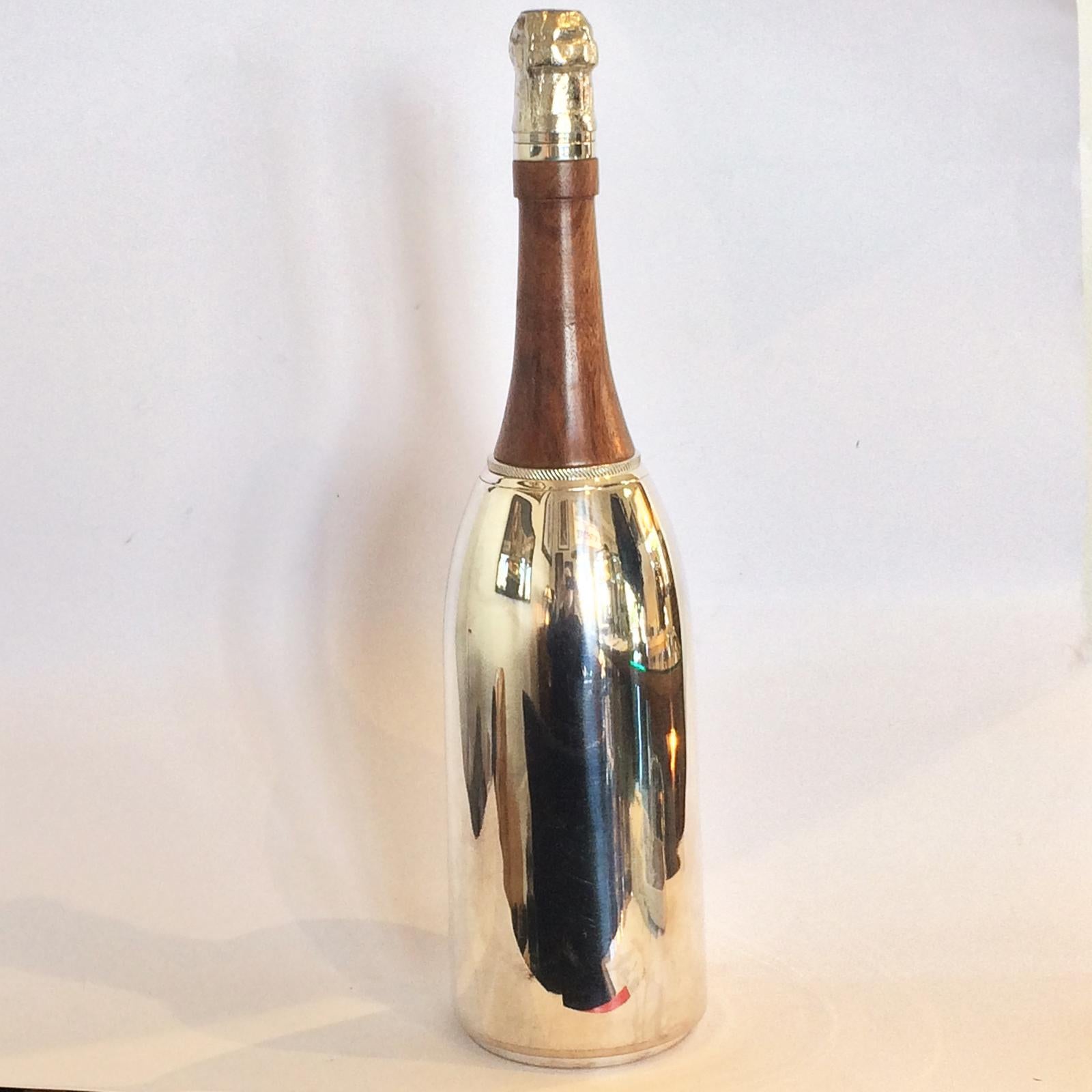 Art Deco cocktail shaker as very realistic champagne bottle, in fine polished timber upper, and extremely high quality silver plate to all other areas and components; interiors are spotless also. Fine details to screw off “cork” at to for pouring;