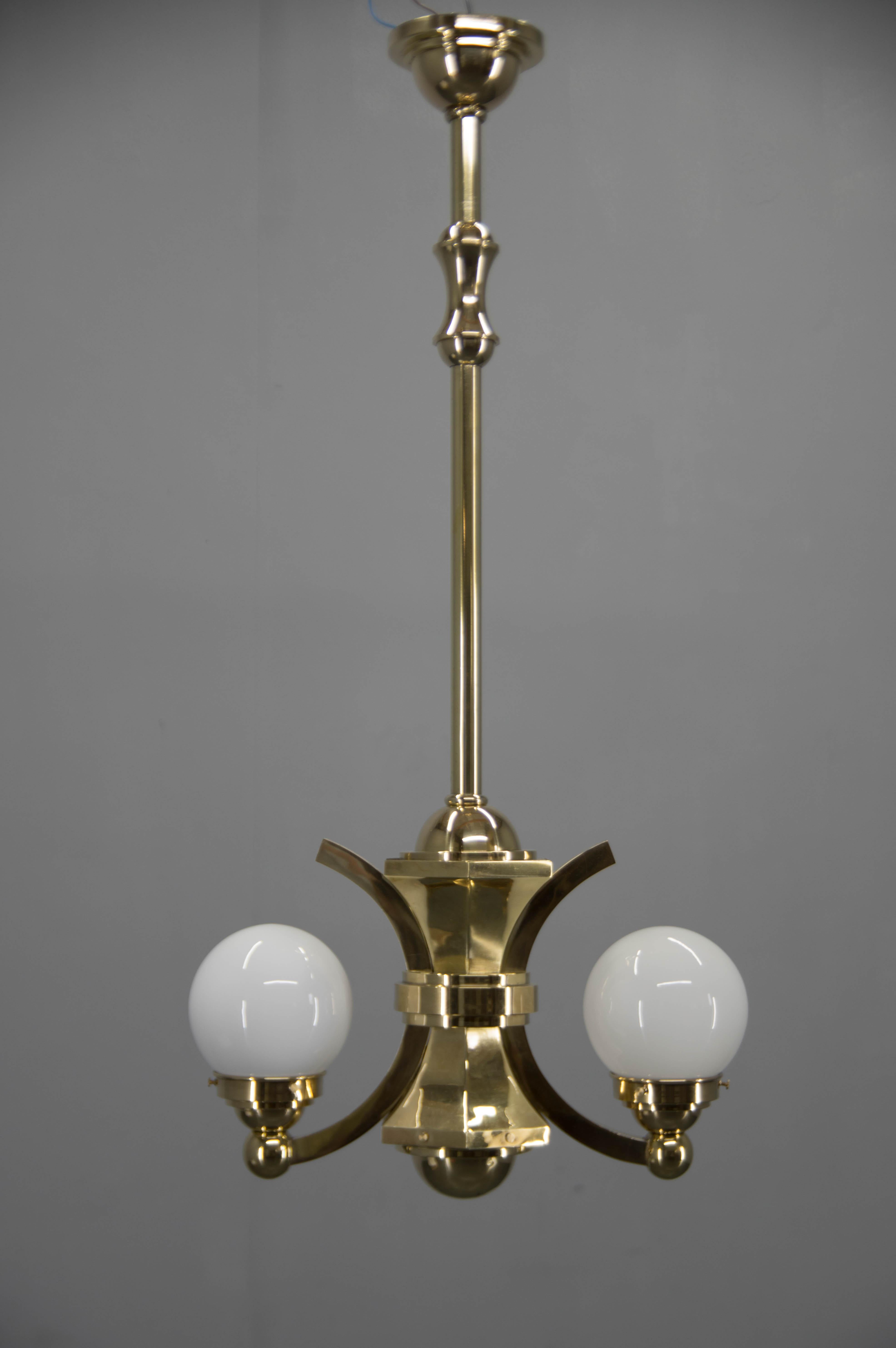 Two-flamming Art Deco chandelier used in Gocar's interiors in1910s-1920s.
Restored, brass refinished, rewired.
2x60W, E25-E27 bulbs
Central rod cen be shortened on request.
US wiring compatible