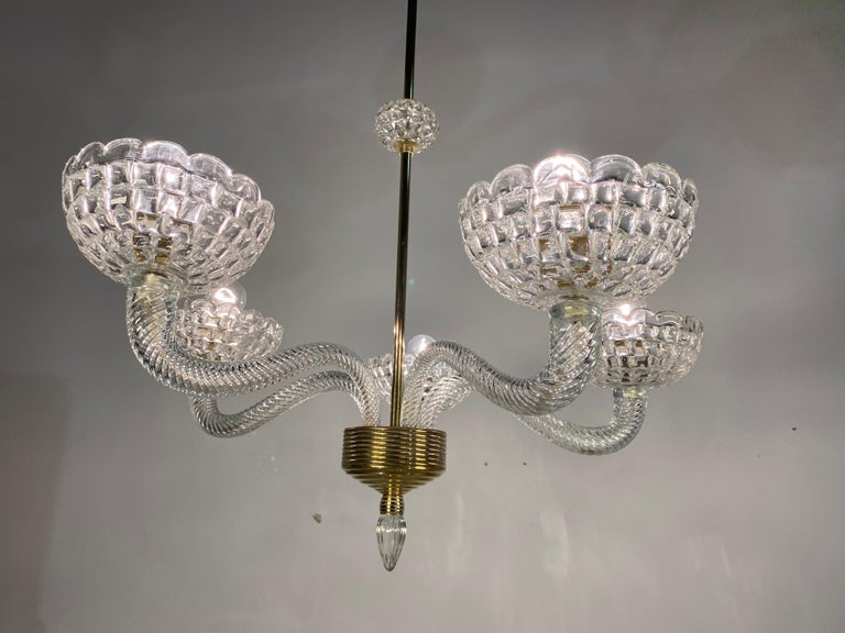 Elegant Murano chandelier by the famous Venetian master Ercole Barovier. Composed of 5 arms with sturdy cups.
   