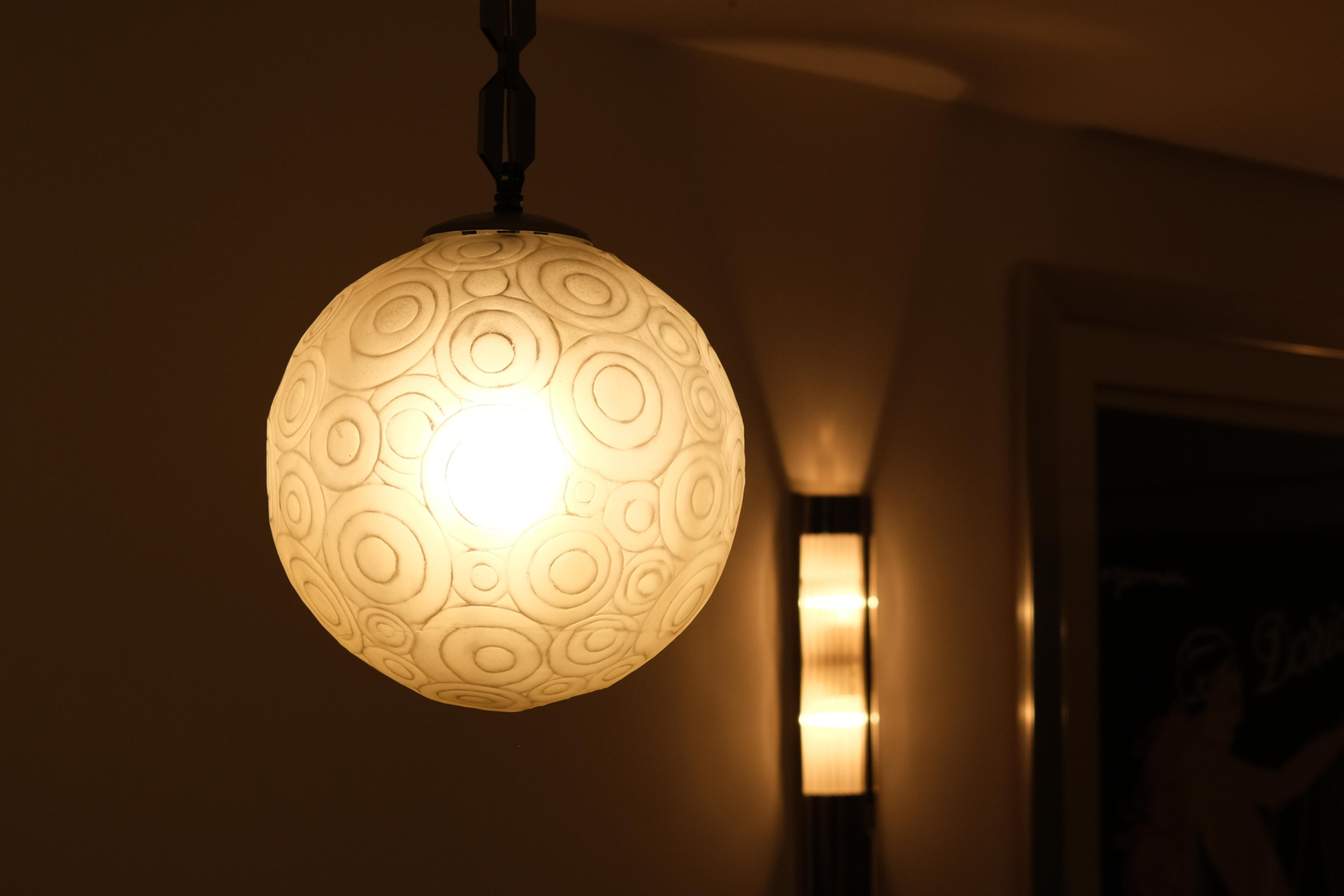 Metal Art Deco Chandelier by Marius-Ernest Sabino, France 1930s, glass ball with chain For Sale