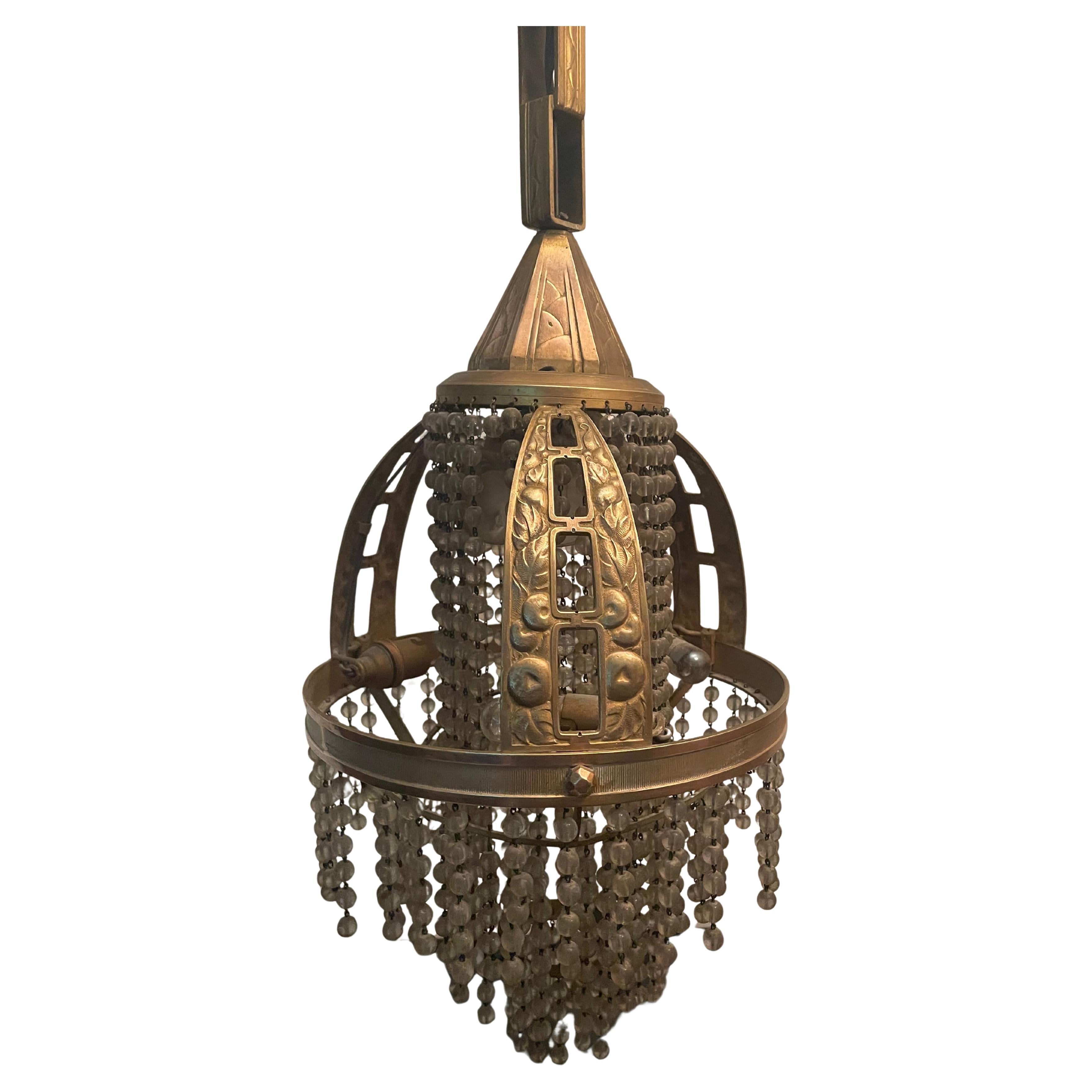 Art Déco chandelier "Cascade" in the style of Sue & Mare. France 1920s. For Sale