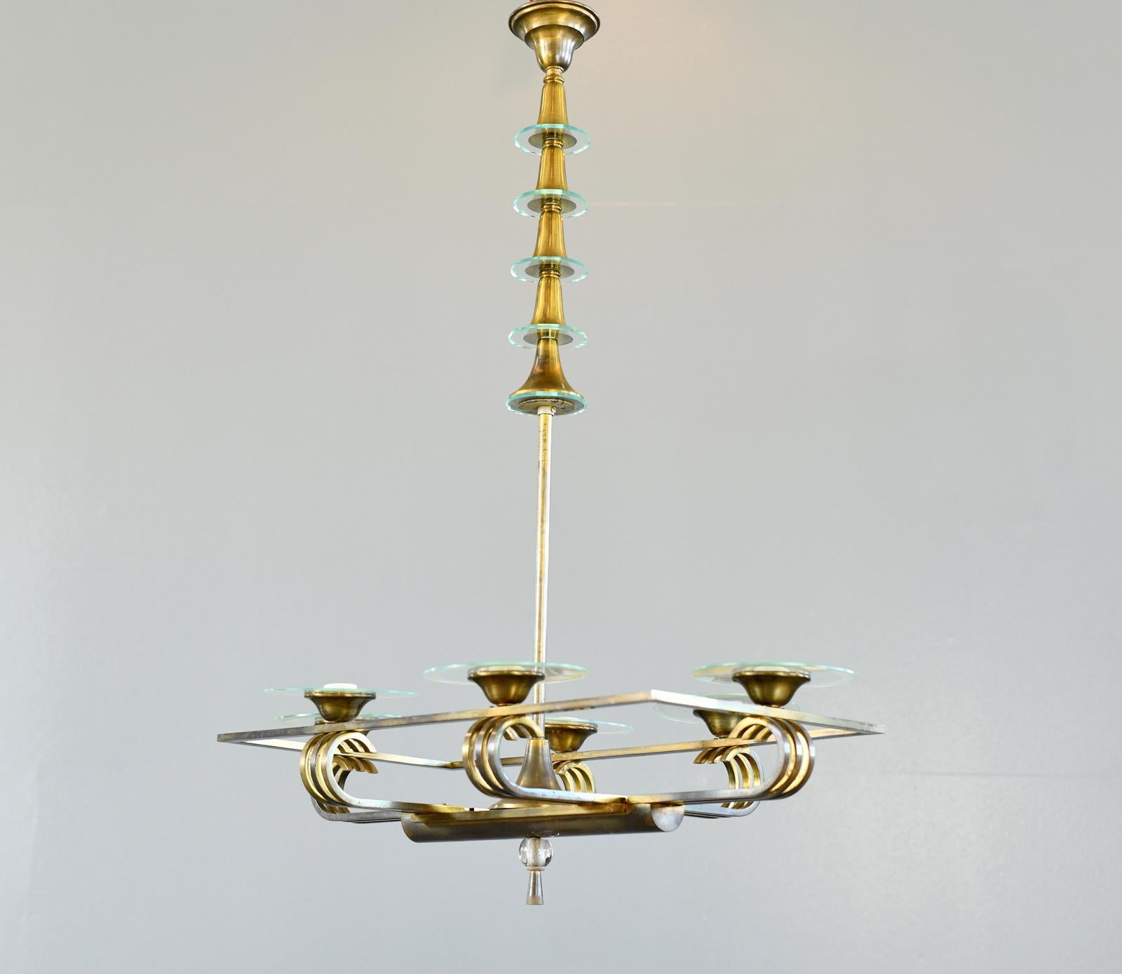 Art Deco Chandelier Circa 1930s

- Brass with glass rings
- Takes 6x E27 fitting bulbs
- French ~ 1930s
- 87cm wide x 56cm deep x 110cm tall

Condition Report

Fully re wired with modern electrical components, some patina to the brass