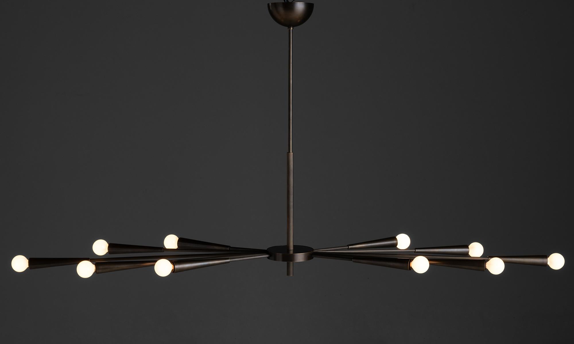 Art Deco Chandelier

Made In Italy

10-arm chandelier with ribbed brass arms.

62”L x 16”d x 32”h