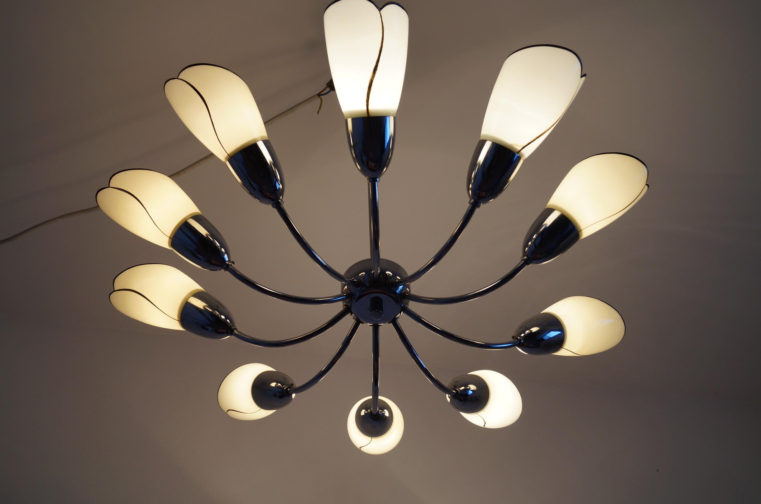 We present 10 arm chandelier from 1950, Czech Republic

Highly recommended item will be perfect complementation of the rooms in not only Classic style, but also Art Deco and modern.

Dimensions:

Diameter 85cm
Height 76 cm.
 