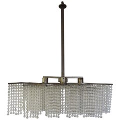 Lustre Art Déco, composé de trois franges de perles et de métal, vers 1930