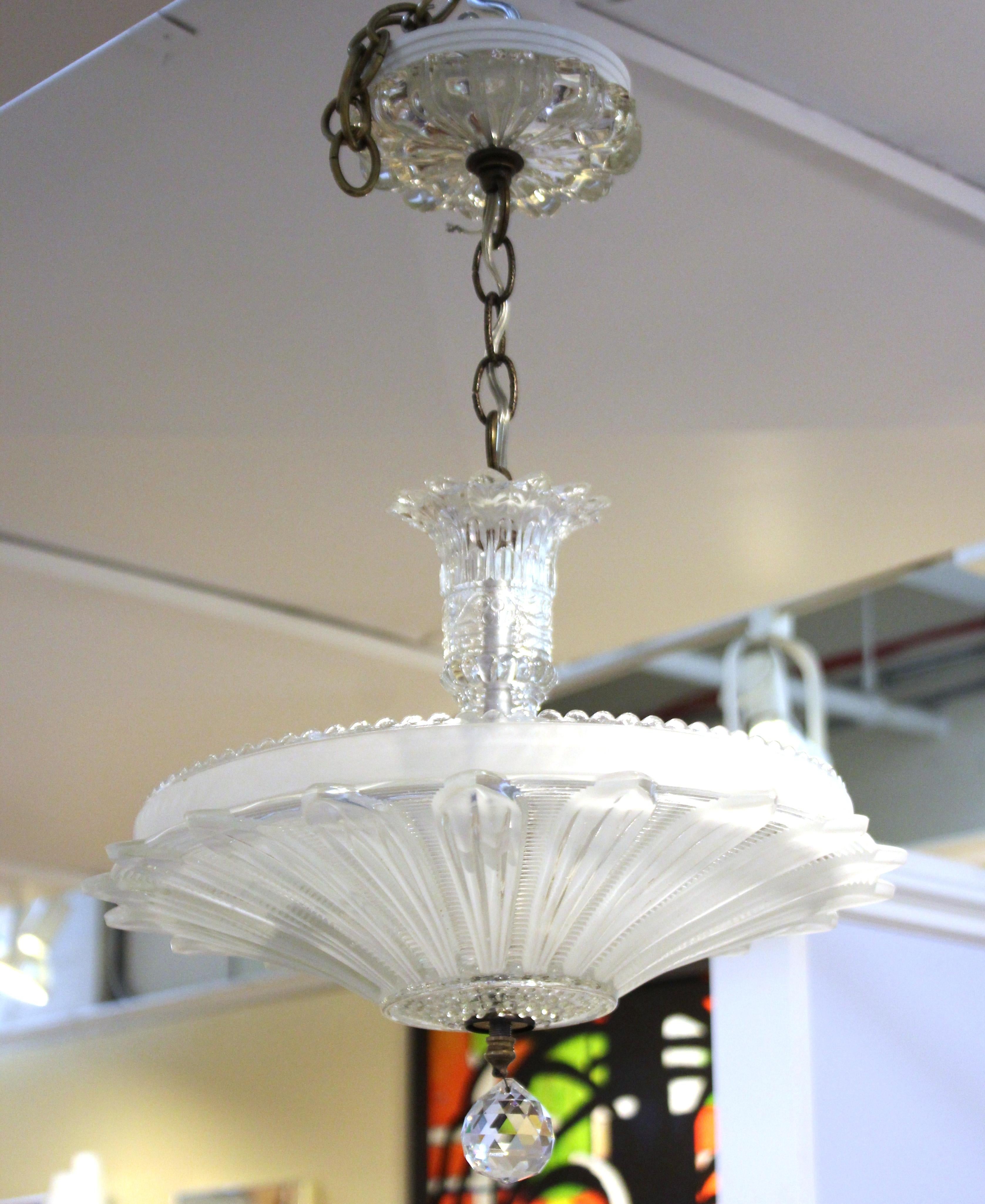 Art Deco period chandelier pendant in cut glass and crystal, made in Europe in the early to mid-20th century. The piece is in great vintage condition with age-appropriate wear and patina to the metal chain.