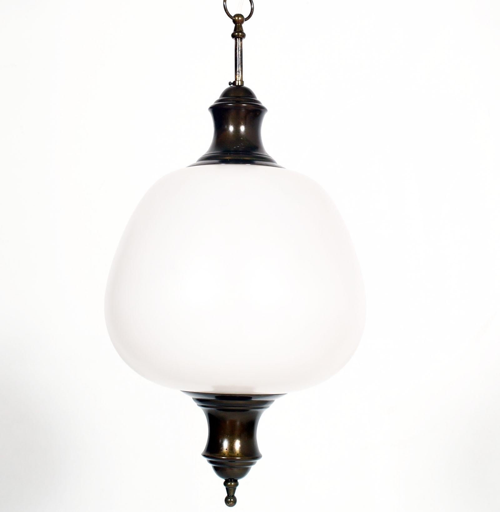 1930s chandelier or pendant lamp with milk glass sphere Venini attributed and burnished brass, overhauled and functioning ready for use.