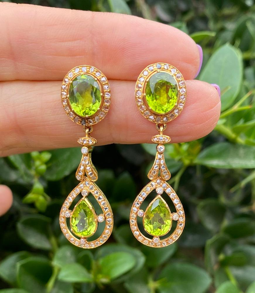 Chandelier Peridot and Diamond Earrings are a dangle set with unique rose cut diamonds  set in a 2 inch in length x 1/2 inch wide setting. 
The diamonds are circa 1800's.
 Earrings are handmade and appear to a be a more modern 1960's setting. Unique