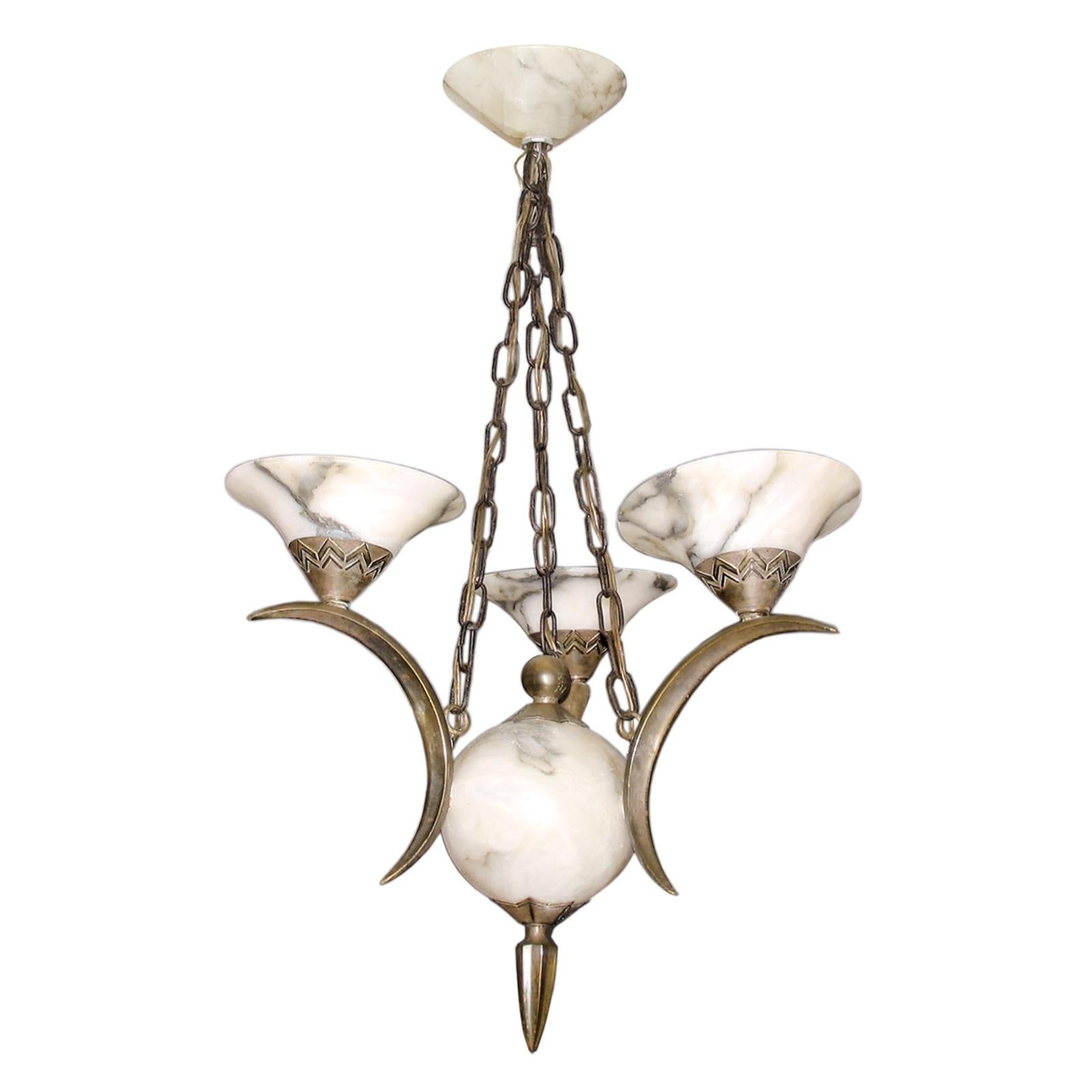Art Deco chandelier silvered bronze and Alabaster attributed to Simonet Freres.
An exceptional Art Deco chandelier attributed to Simonet Freres, France, 1920s.
Chandelier with three arms made of silvered bronze, each ending with an alabaster