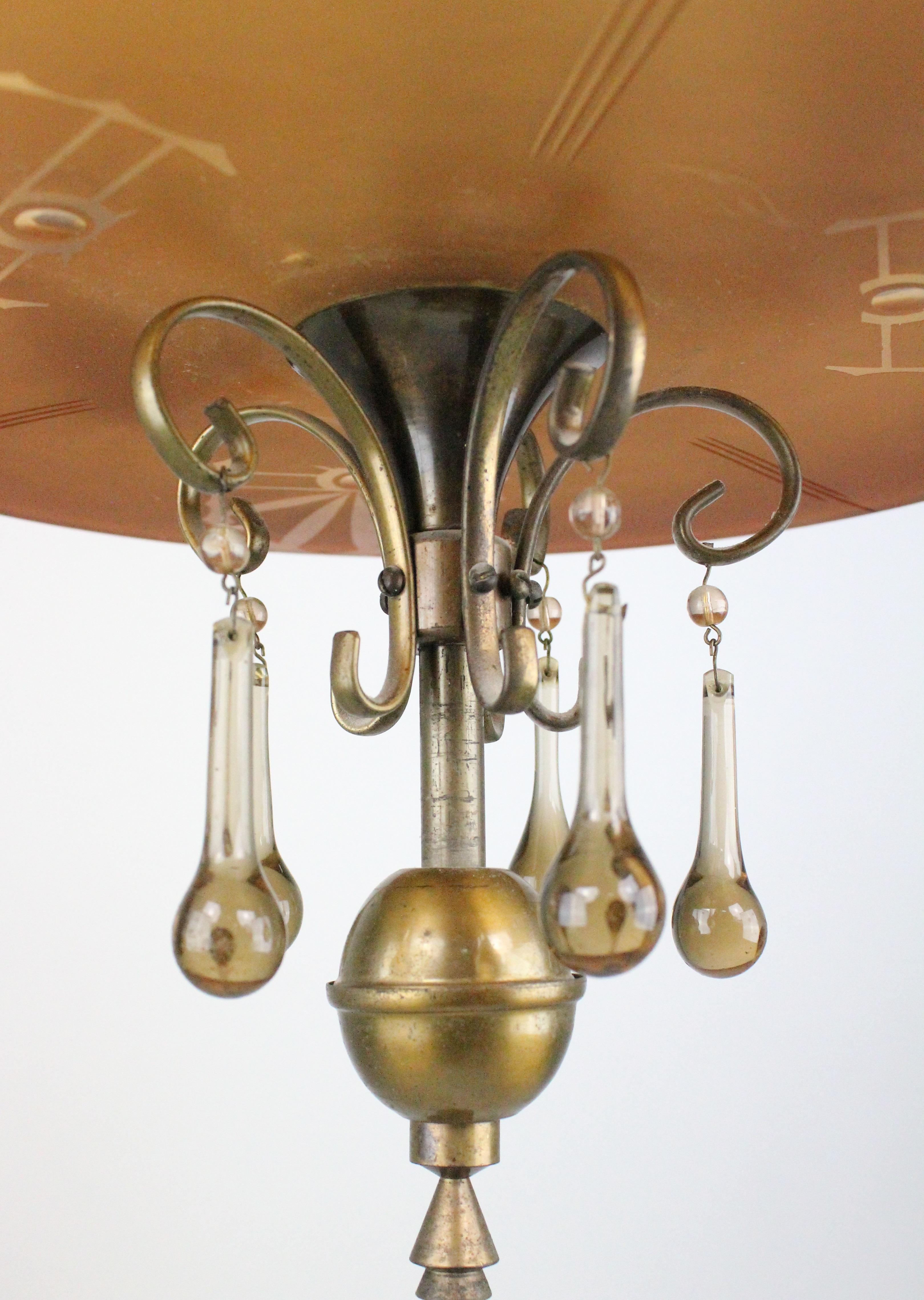 Wonderful and unusual Swedish 1920s chandelier in amber colored glass and bronze.
In full working order. Great original condition. No damages. Most likely made by Orrefors.
Holders for four light bulbs. Very stylish, makes a great statement. Great