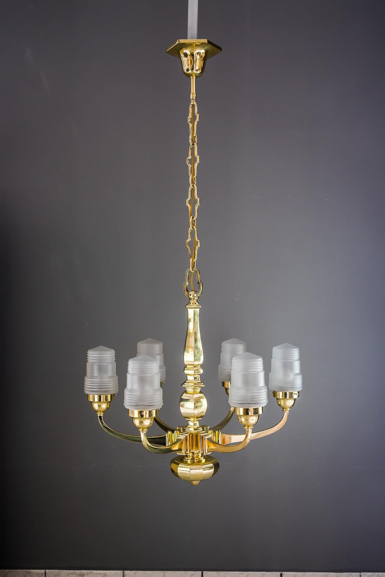 Art Deco chandelier Vienna 1920s with original glass shades
Brass polished and stove enamelled
Original glass shades.