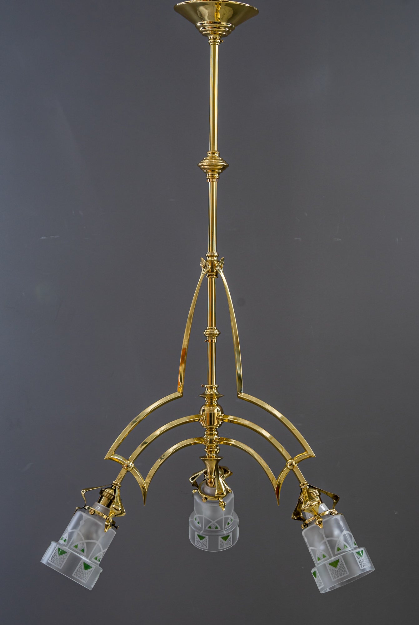 Art Deco Chandelier vienna with glass shades around 1920s 
Brass parts polished and stove enamelled
Beautiful old original glass shades.