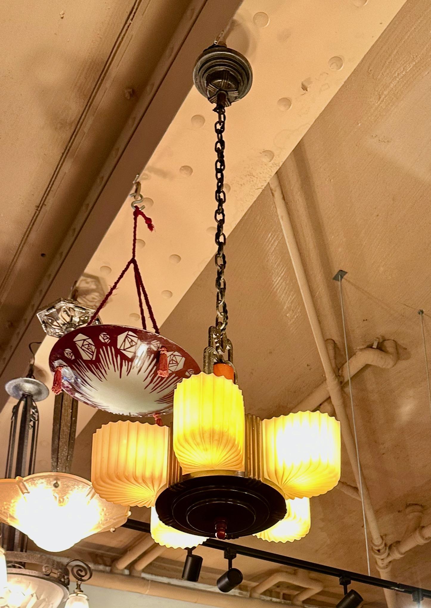 Art Deco Chandelier with Bakelite and Faceted Slip Shade Glass. Made in the USA, one of my favorite American light fixtures. I was lucky enough to buy 3 of them from a house where they were hung for many years. This does not happen ever! This model