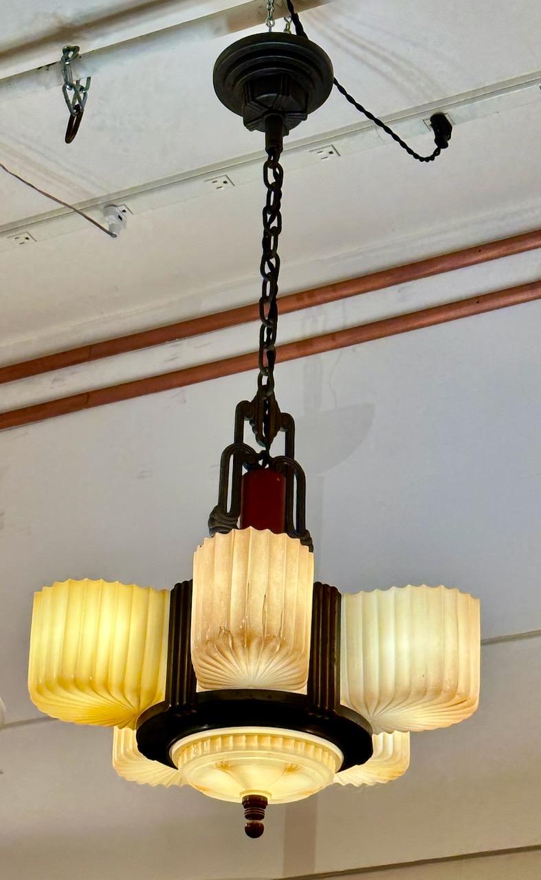 Art Deco Chandelier with Bakelite and Faceted Slip Shade Glass. Made in the USA, one of my favorite American light fixtures. This model has all the original bakelite round supports above the glass with matching finials on the bottom. Very hard to