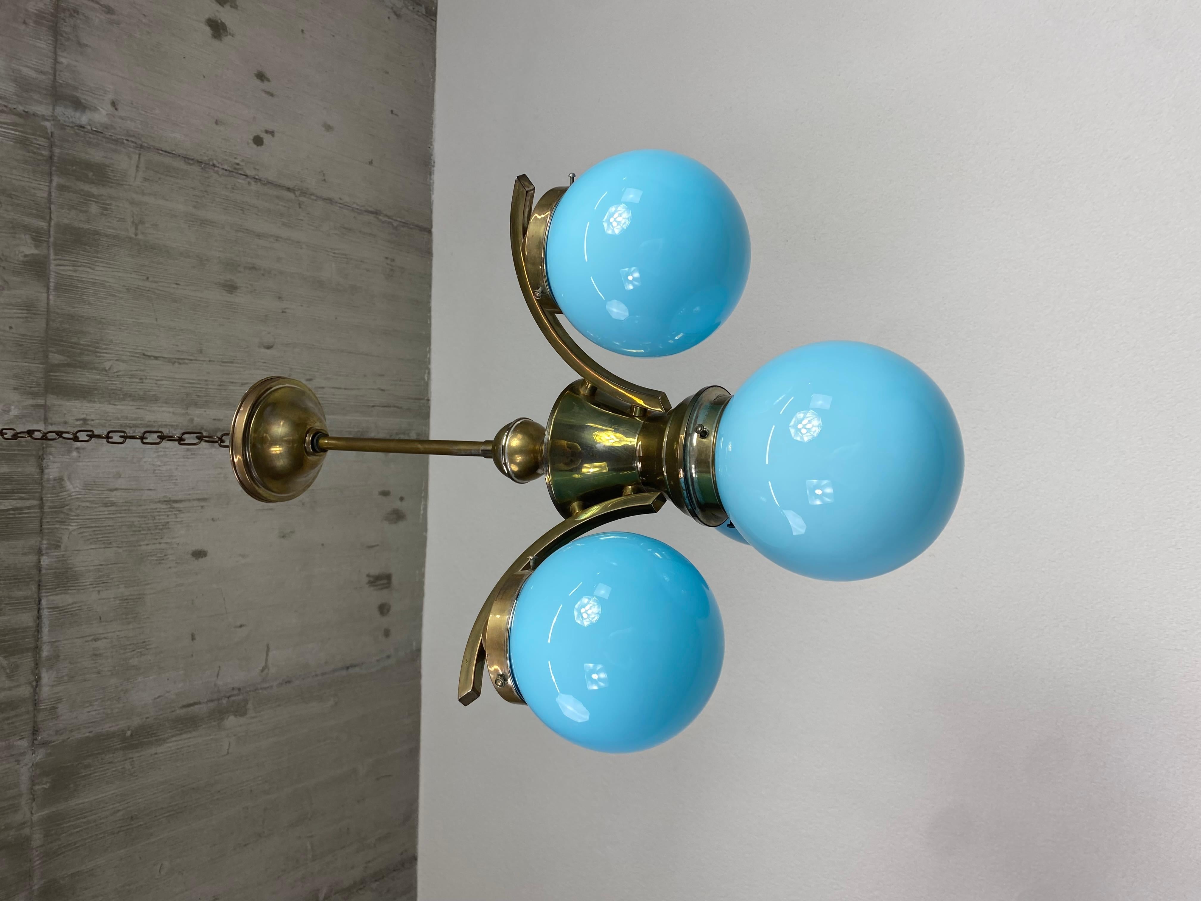 Art deco chandelier with blue lampshades in original vintage condition.
