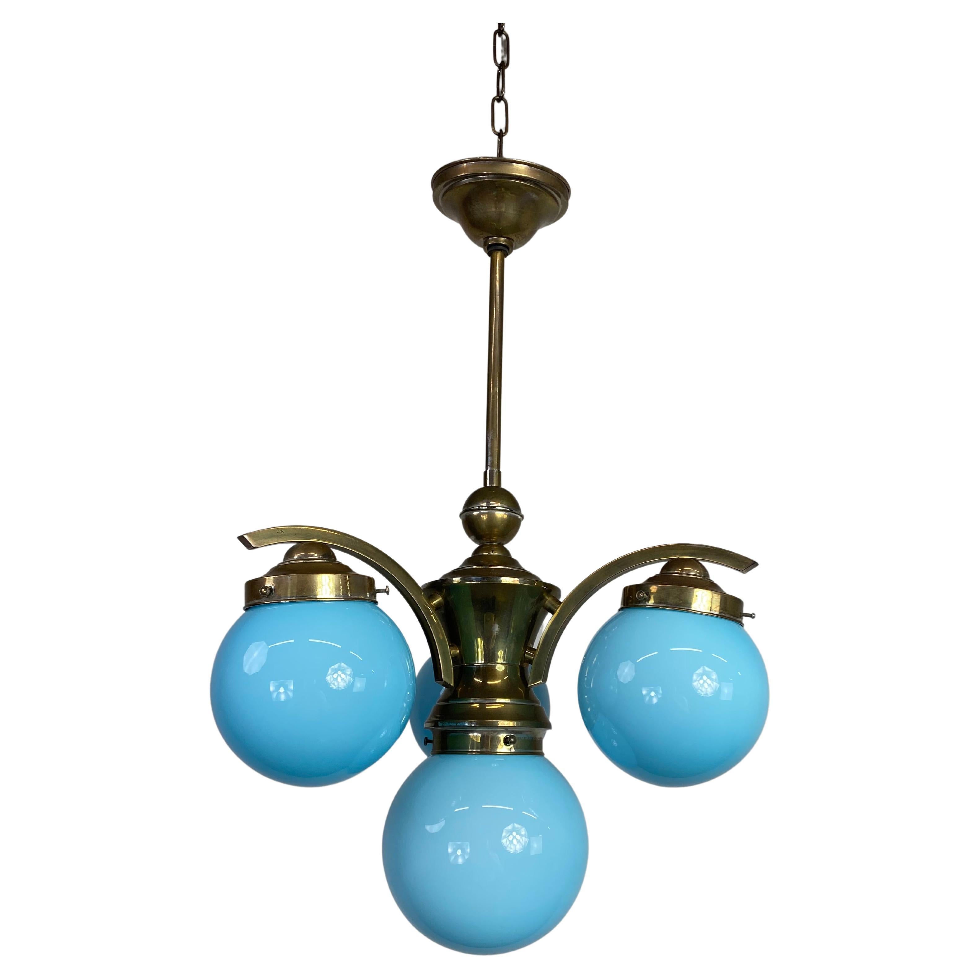 Art deco chandelier with blue lampshades