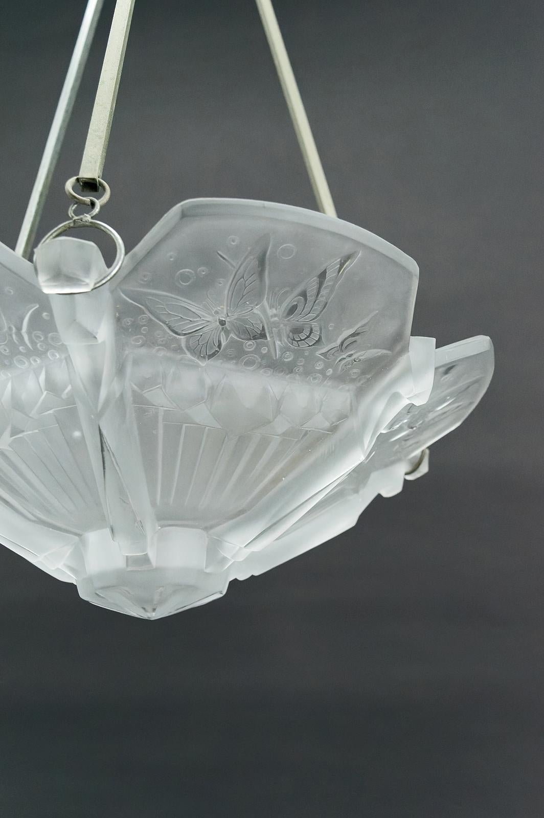 Metal Art Deco chandelier with butterflies, signed Muller Frères, France, Circa 1920 For Sale