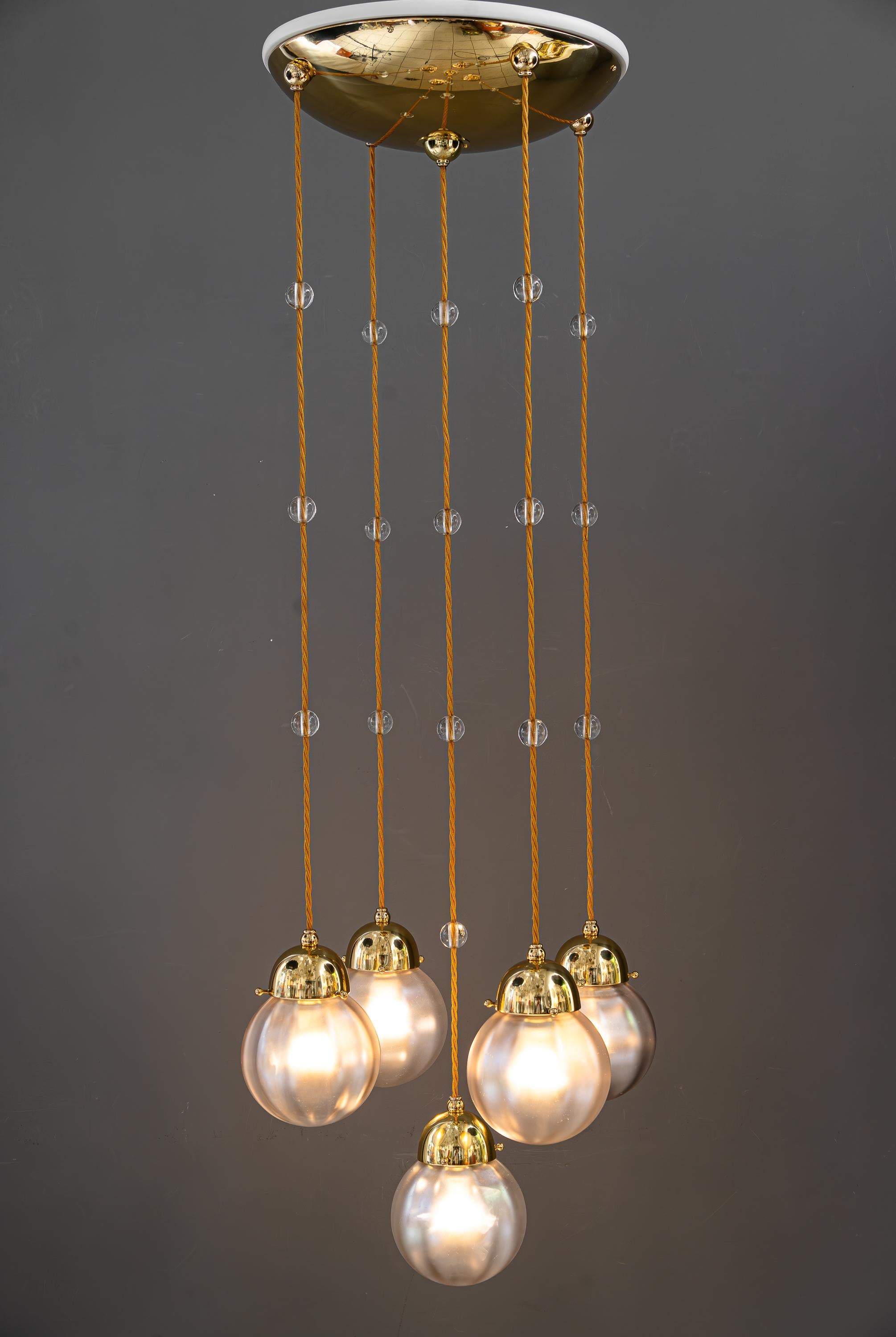 Brass Art deco chandelier with iridescent glasses atributed. koloman moser around 1920 For Sale