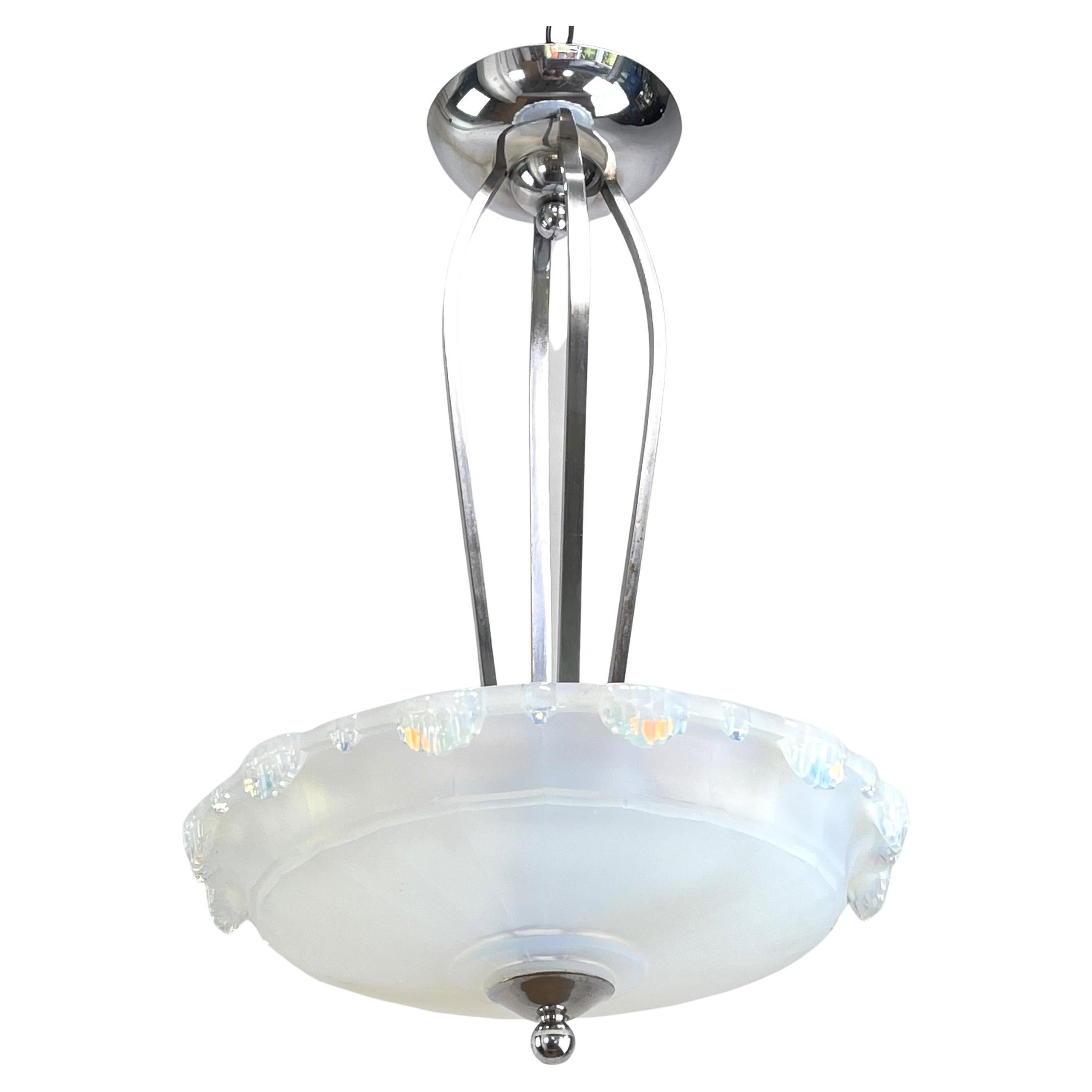 Art Deco Chandelier  - 1930s

This original pendant lamp captivates with its simple and sober Art Deco design. The lamp is not signed and gives a very pleasant light. This ceiling lamp is an absolute design classic from the ART DECOS period.

The
