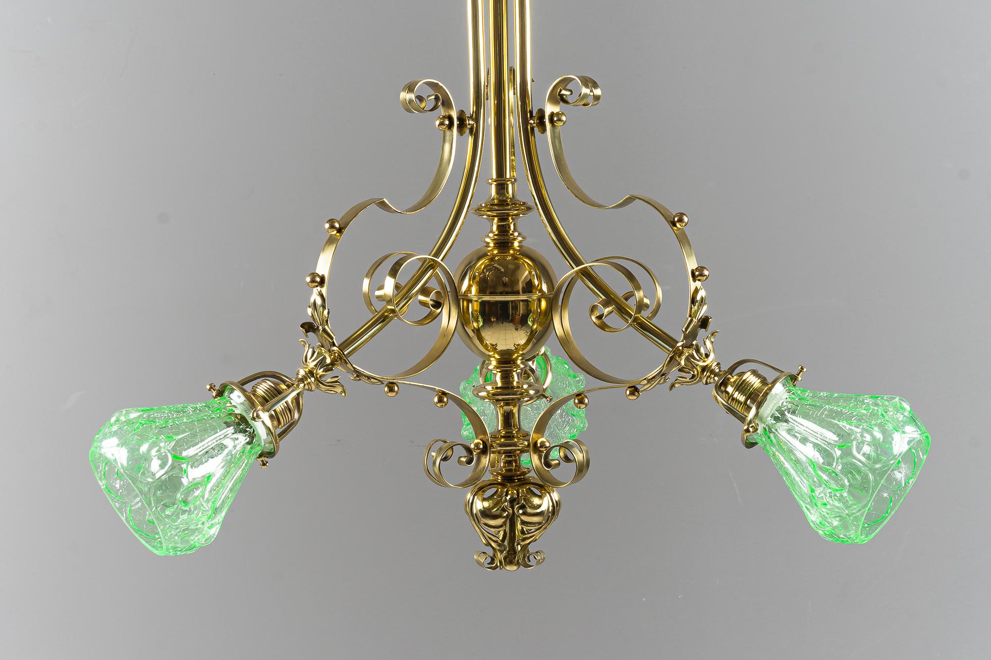 Art Deco chandelier with original glass shades vienna around 1920s
Original opaline glass shades
Polished brass and stove enamelled.