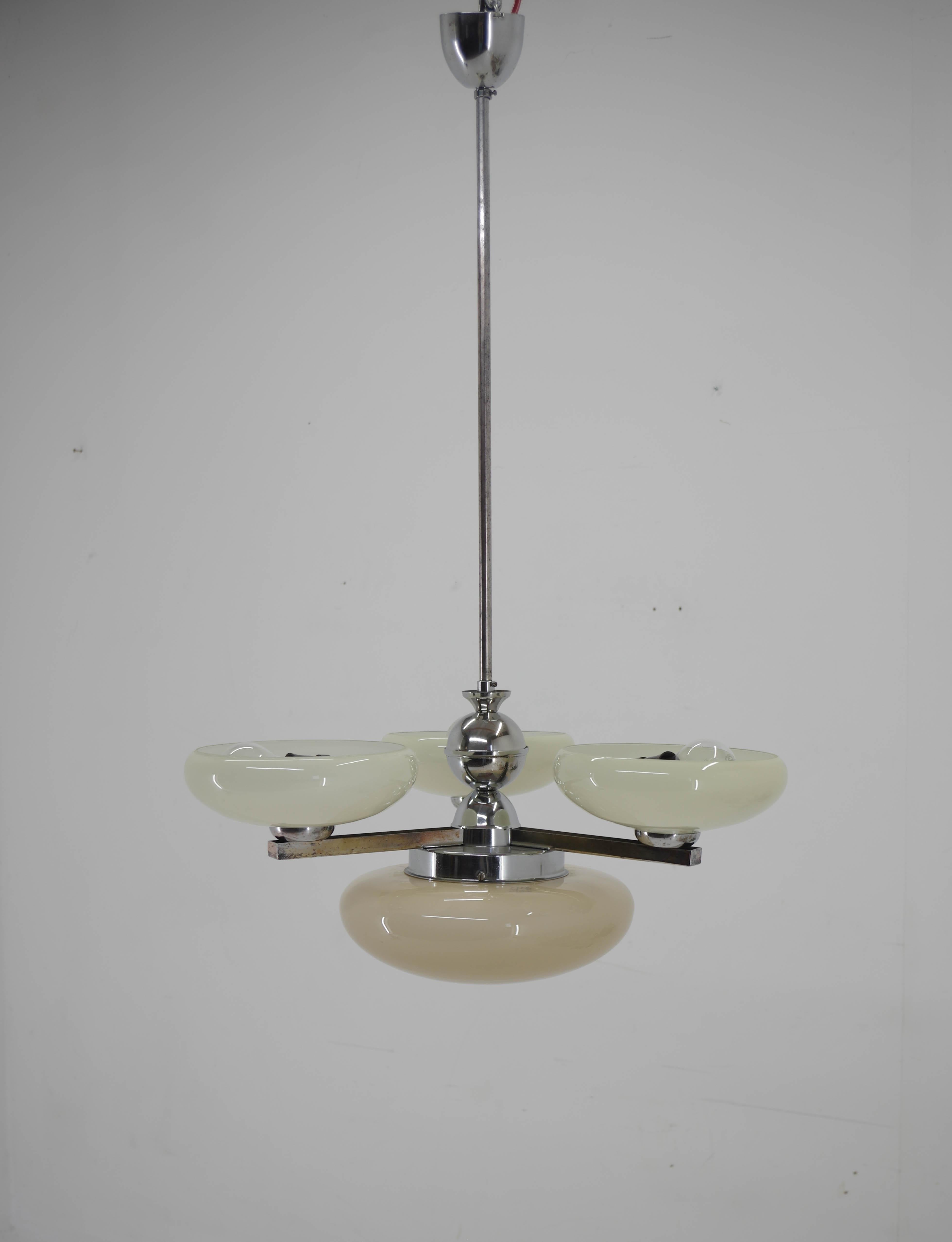 4-flamming Art Deco chandelier.
Blown glass shades - bottom glass is marked and has a slightly different color.
Chrome with age patina
Rewired: two separate circuits - 3+1x40W, E25-E27 bulbs
US wiring compatible