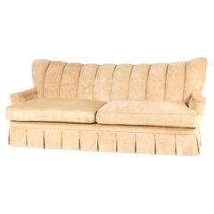 Tall Channel Back and Skirted Art Deco Sofa In Camel Velvet.