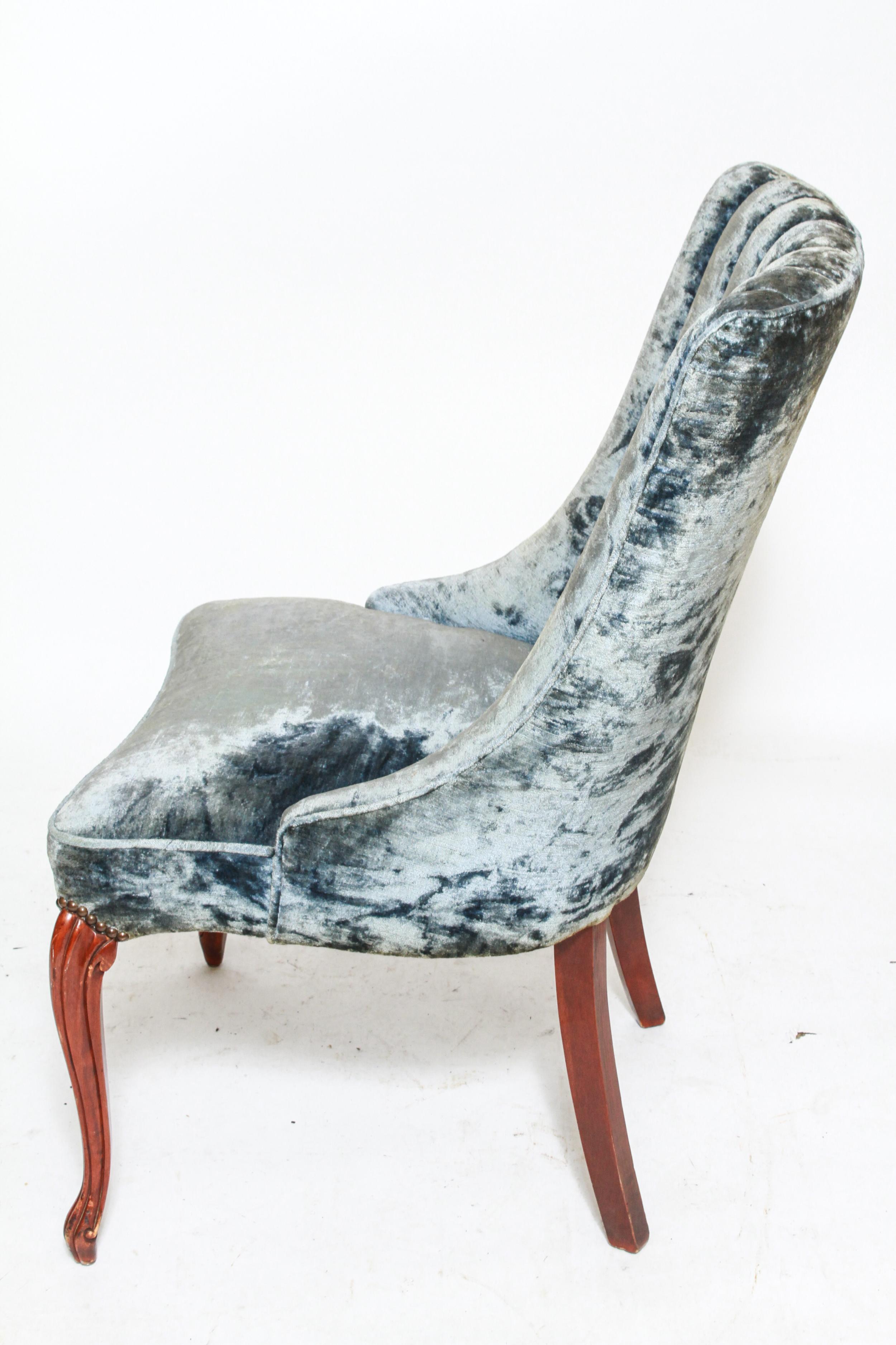 Art Deco period upholstered blue velvet channel-back side chair with carved cabriole front legs. The piece is in great vintage condition with minimal age-related wear to the legs.