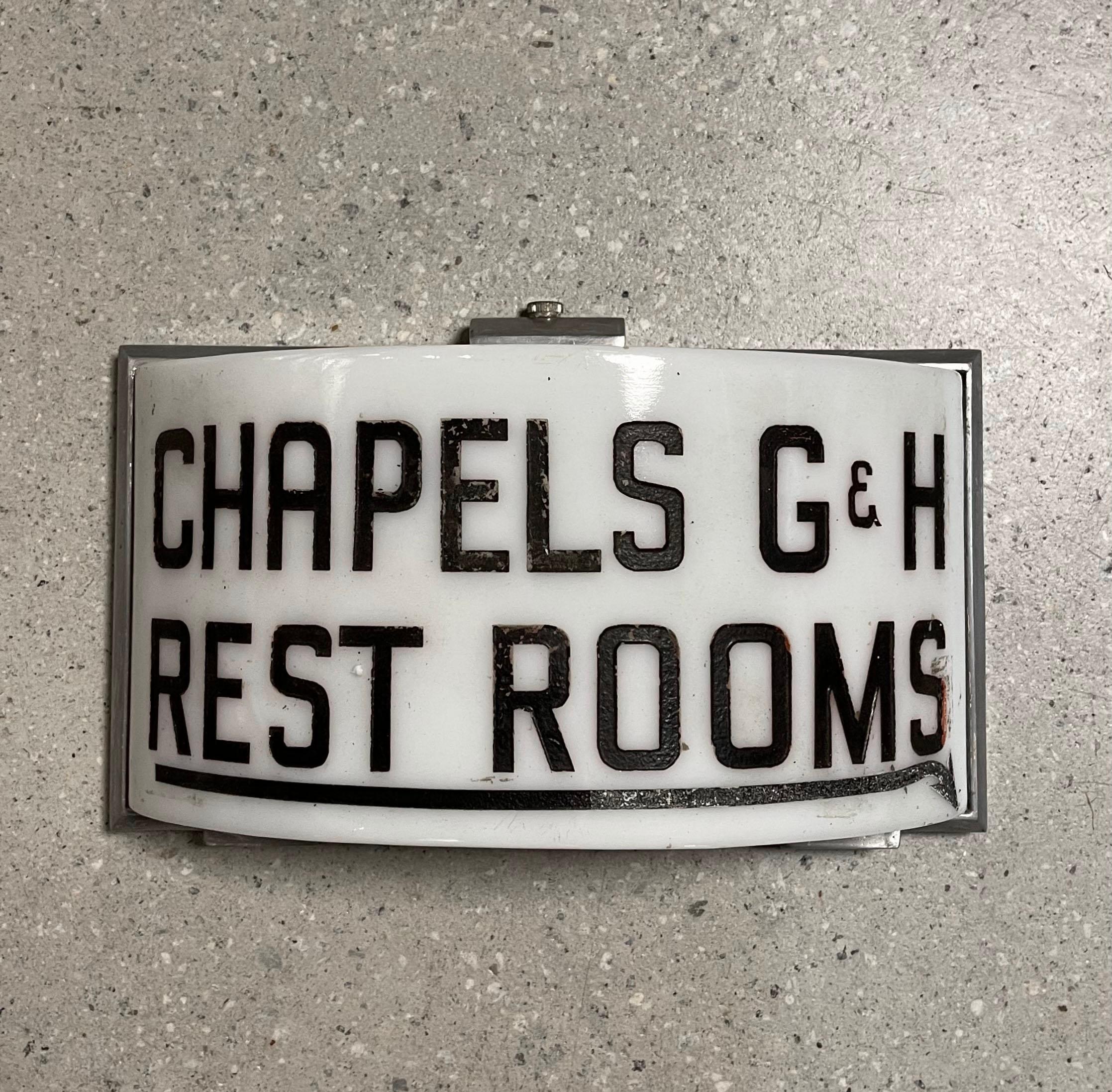 Early 20th century, Art Deco, chapel restroom sign, wall sconce light features a hand etched opaline shade with aluminum frame. The sign is wired to accept one medium socket bulb.