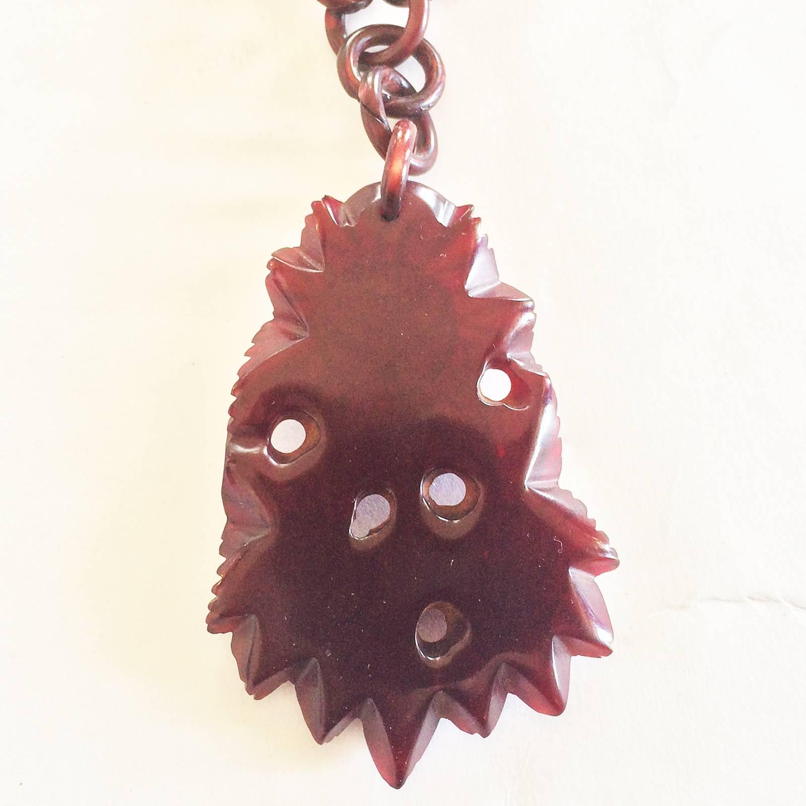 Art Deco, Very Rare Cherry Red Bakelite Necklace, with fantastic Pendant, very fine, pierced carving, with 3 interlocking Roses and leaves, with continuous, original linked chain. For this piece to have survived in such pristine condition with the